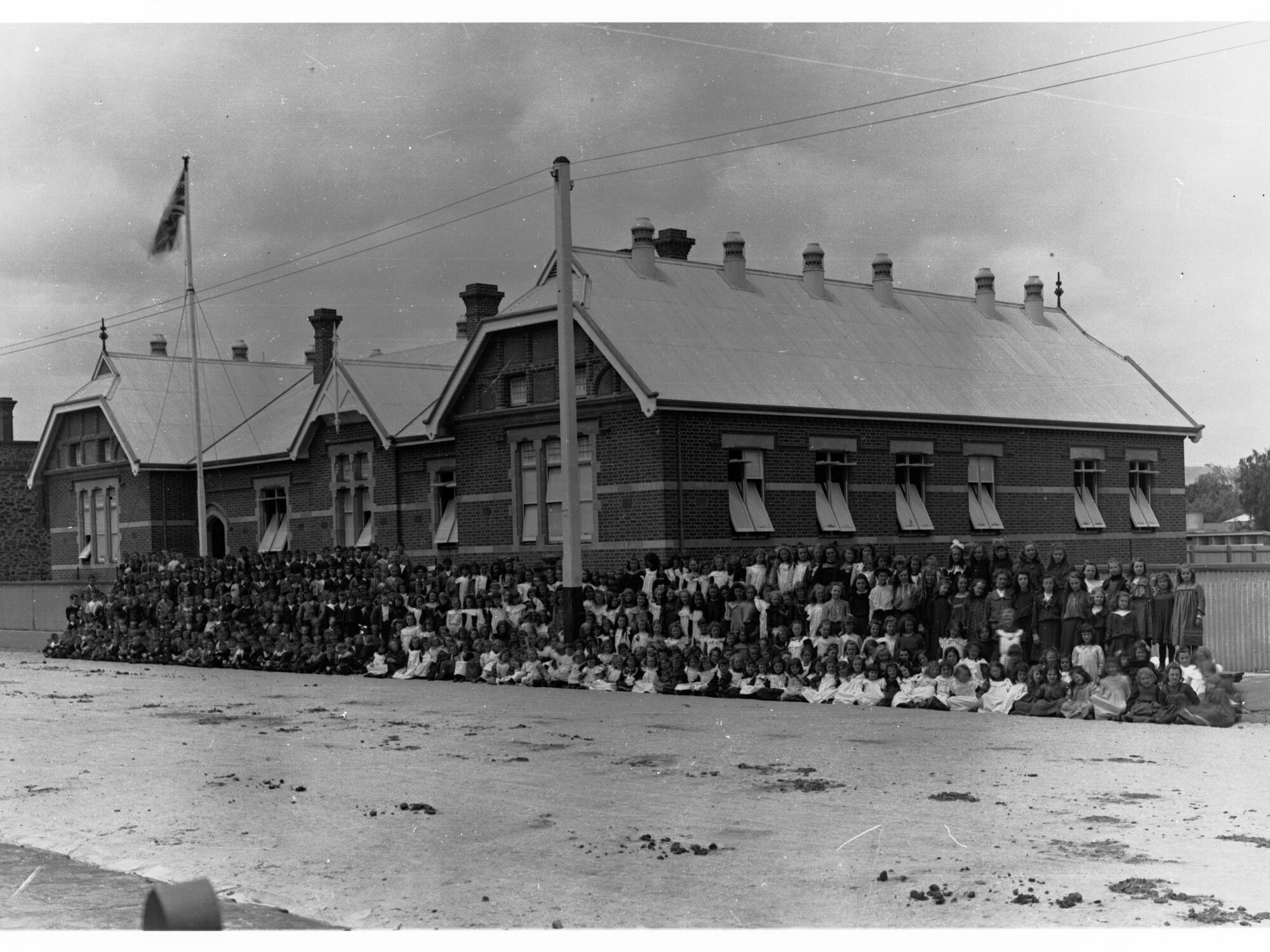 Gilles Street School Building Showing Children in Front
