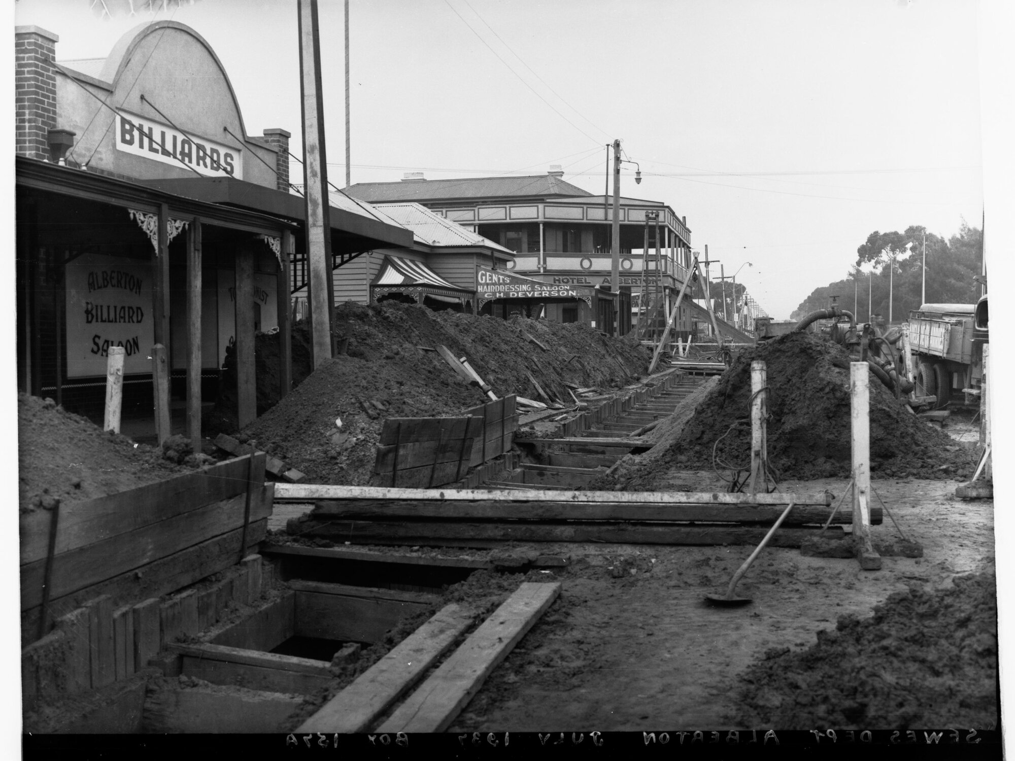 Sewers Department - Alberton, Pipes being laid through street