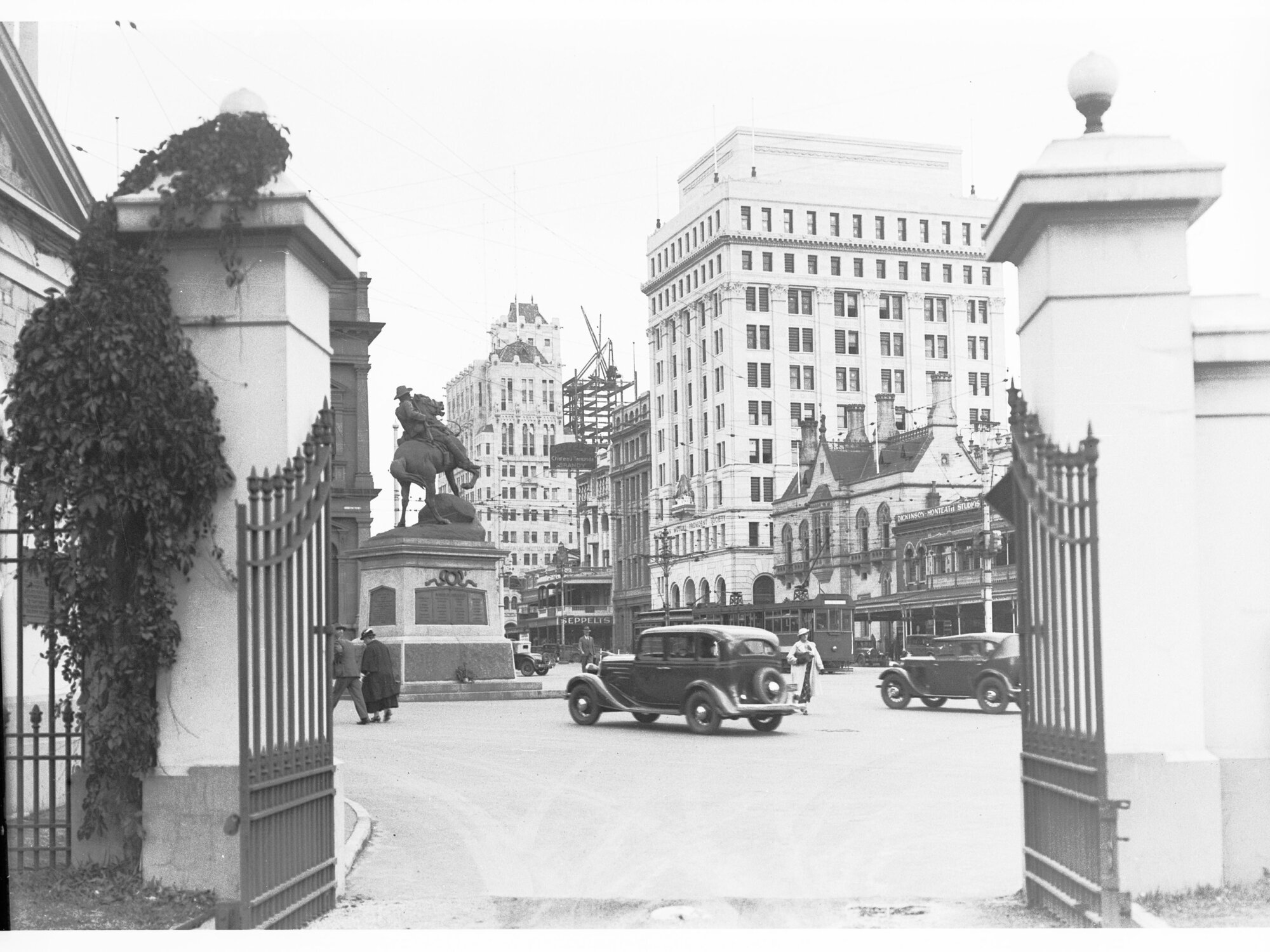View towards King William Street from Government House gates - shows South Africal (Boer) War Memorial and trams on King William Street