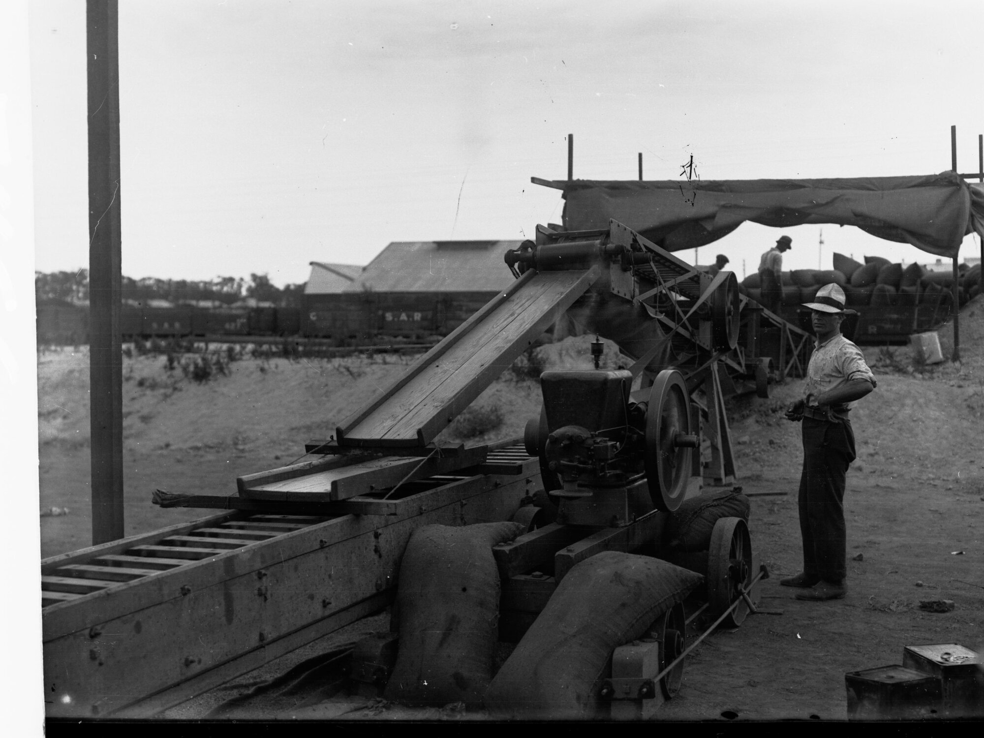 Machine Loading Sacks of Wheat at Keswick Railway Station