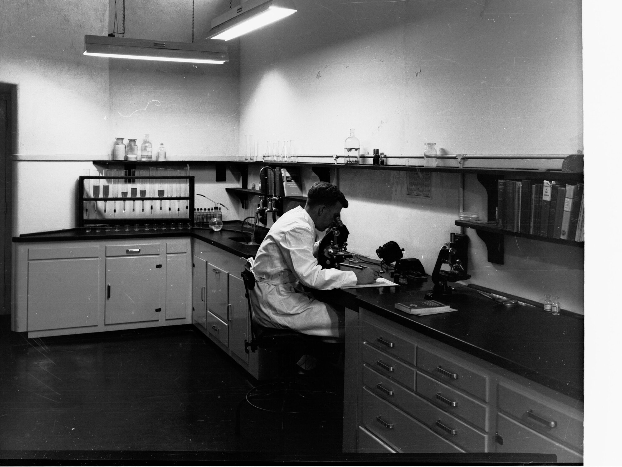 Engineering and water supply, showing man working in laboratory - Glenelg Sewerage Treatment Works