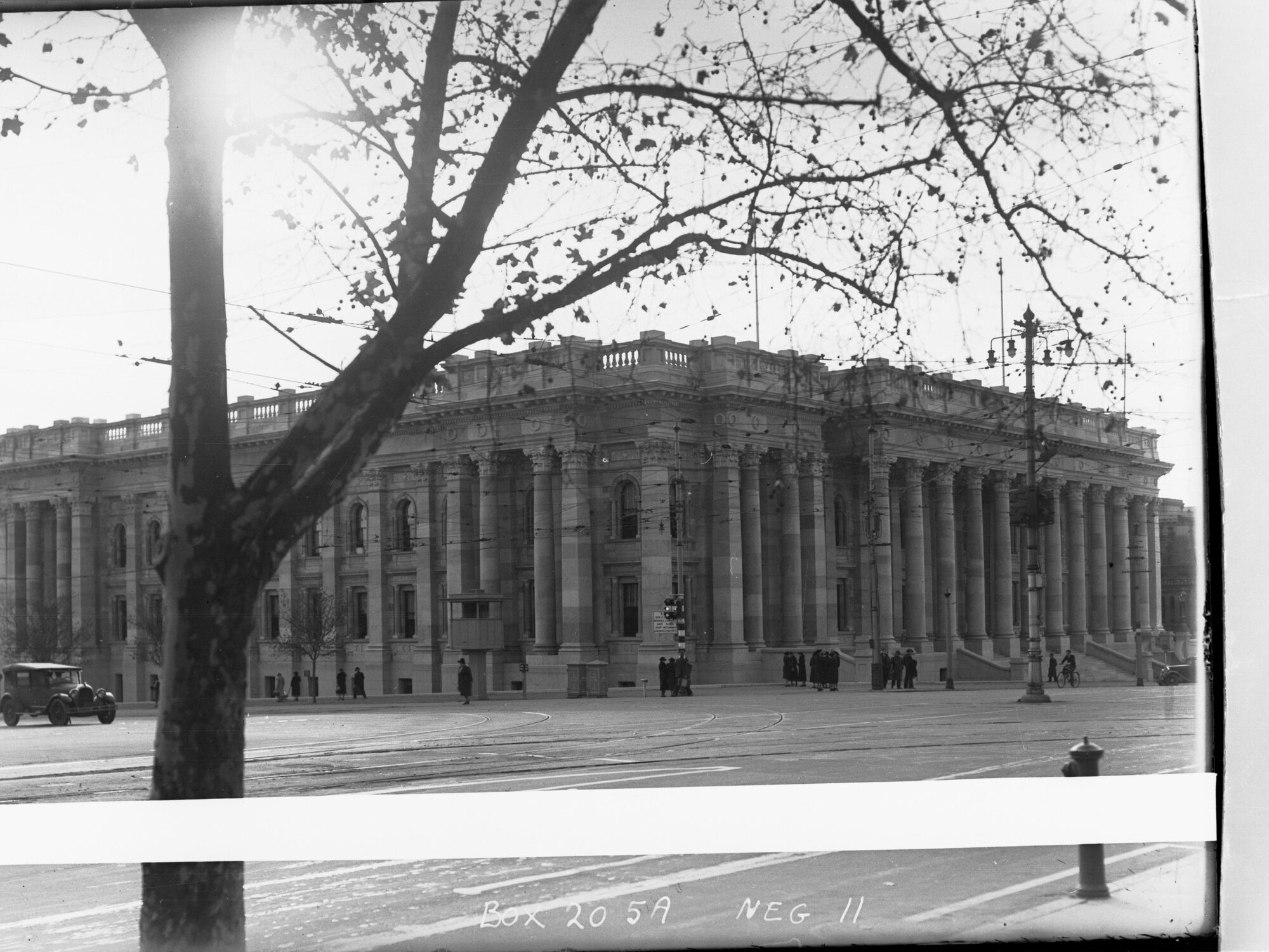 Parliament House, viewed from opposite corner with tree framing picture