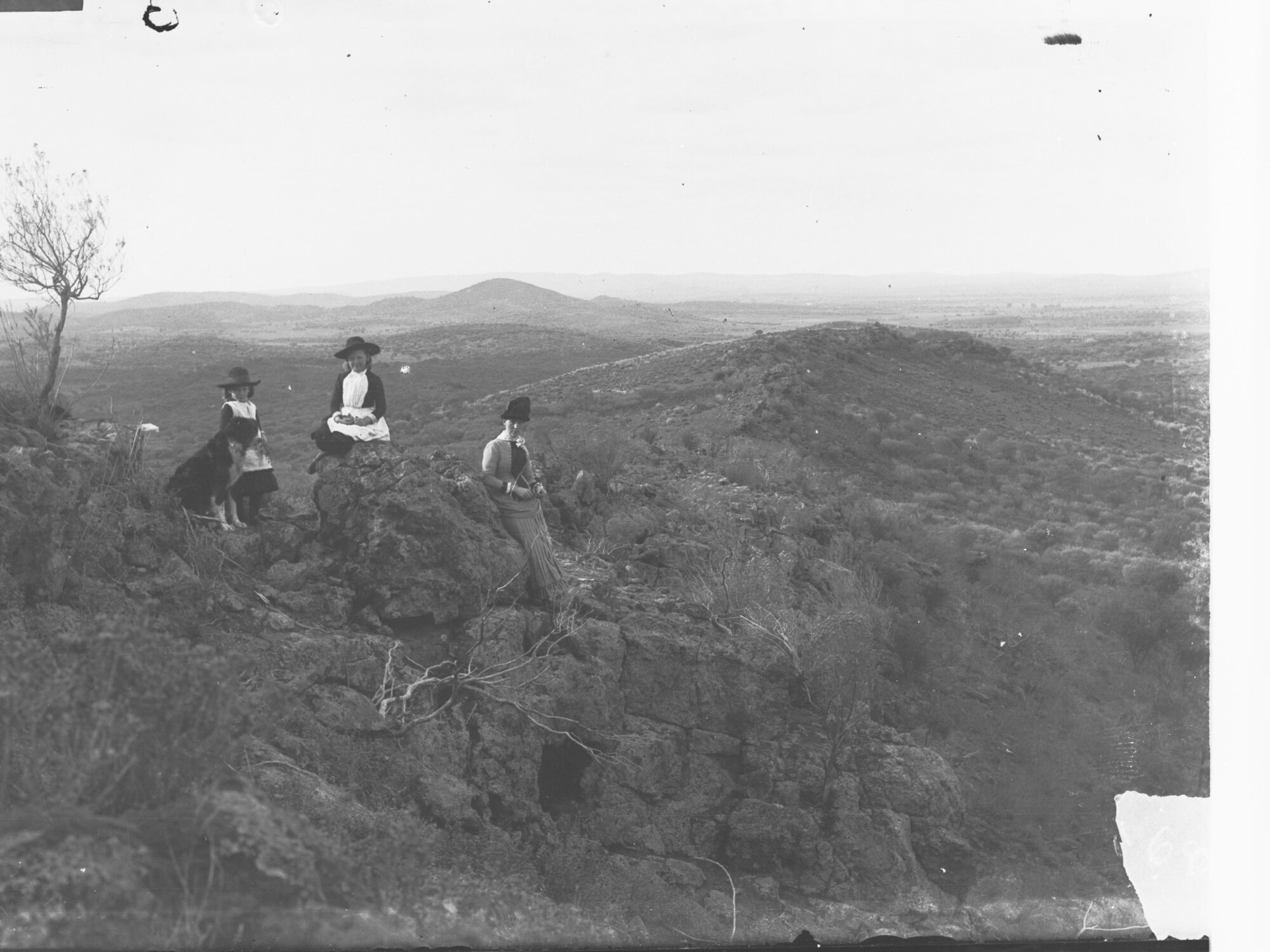 Lady and two girls on rocks - Flinders Ranges