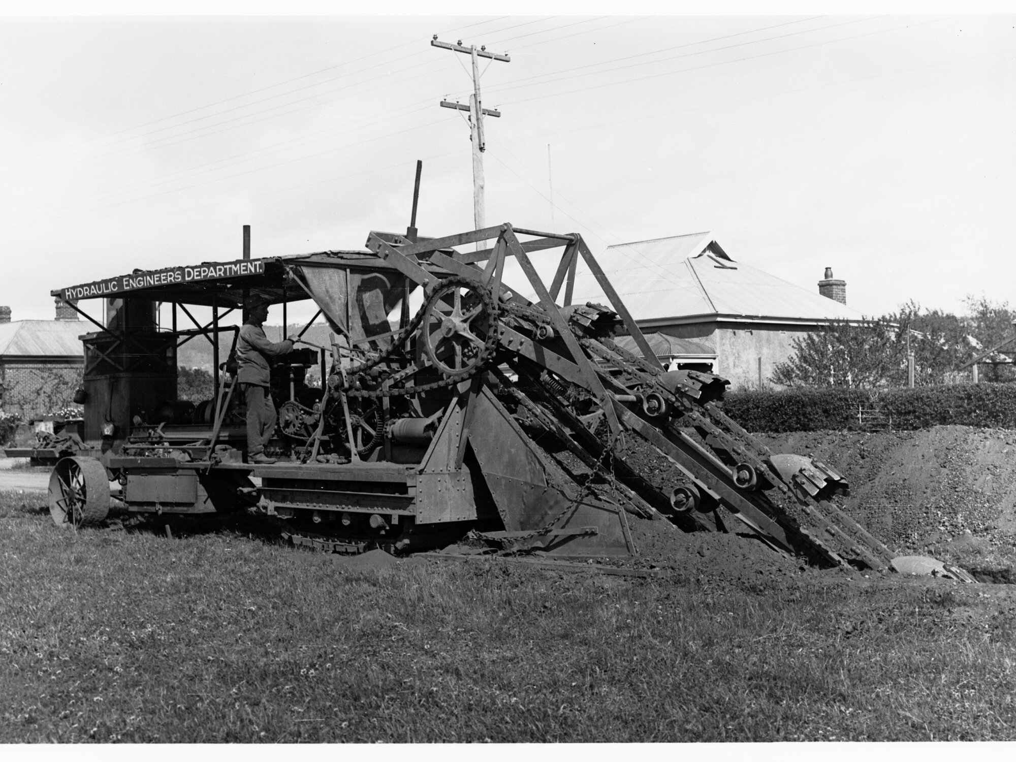 Earthmoving machinery digging ditches at Edwardstown for sewerage