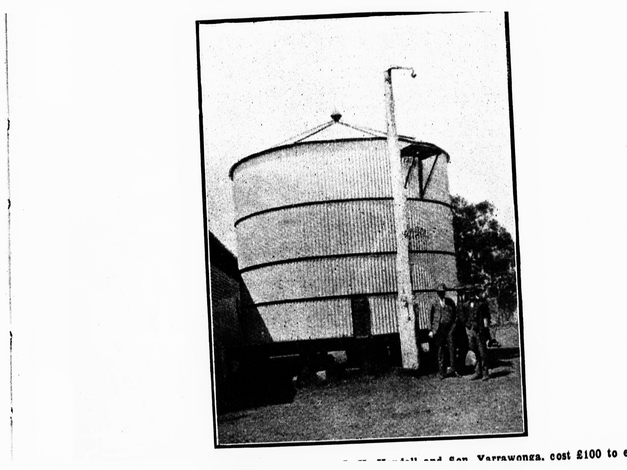 A Bin for Oats - two men standing in front of it