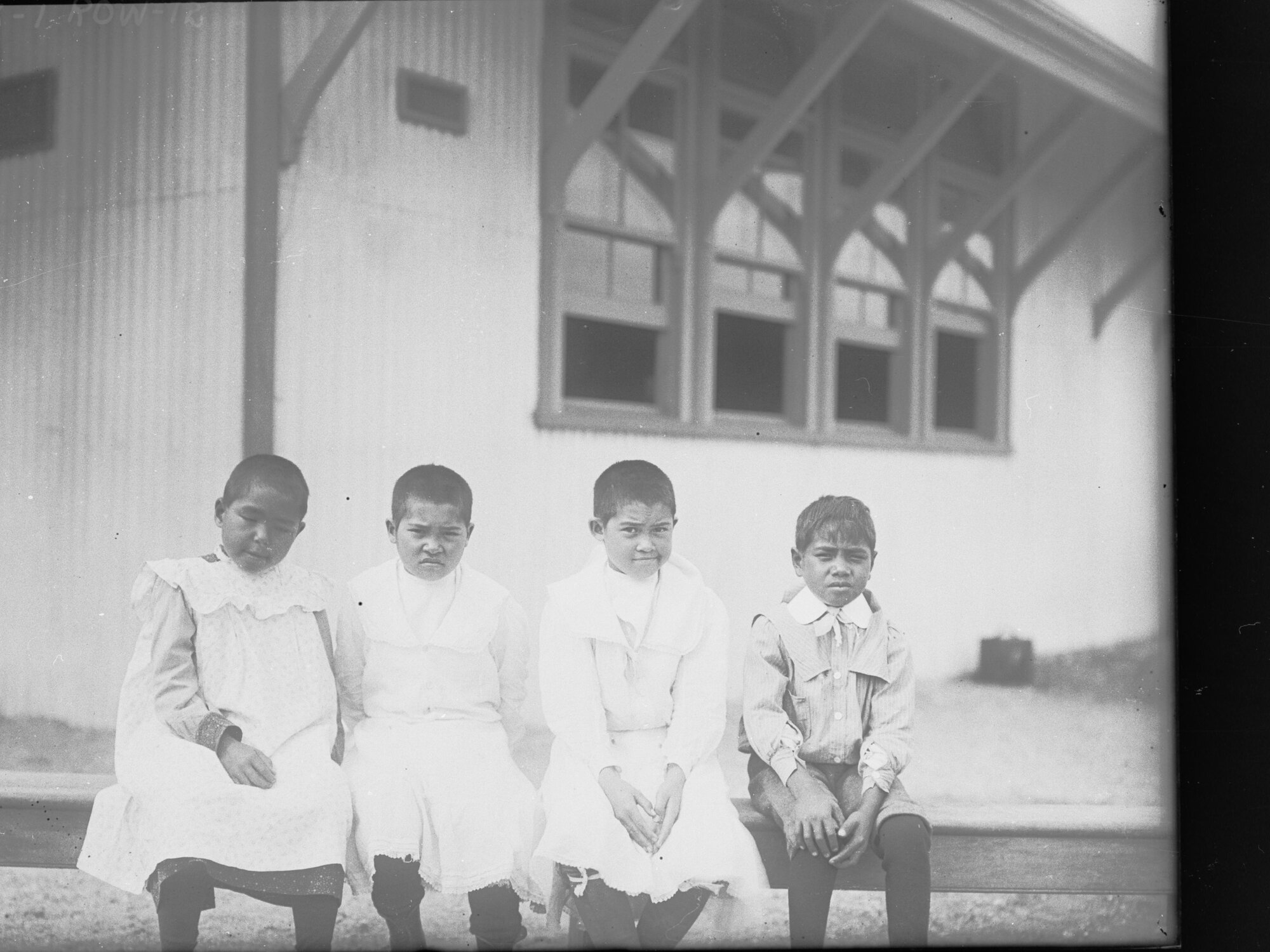 Children sitting outside school building,  Oodnadatta, South Australia 