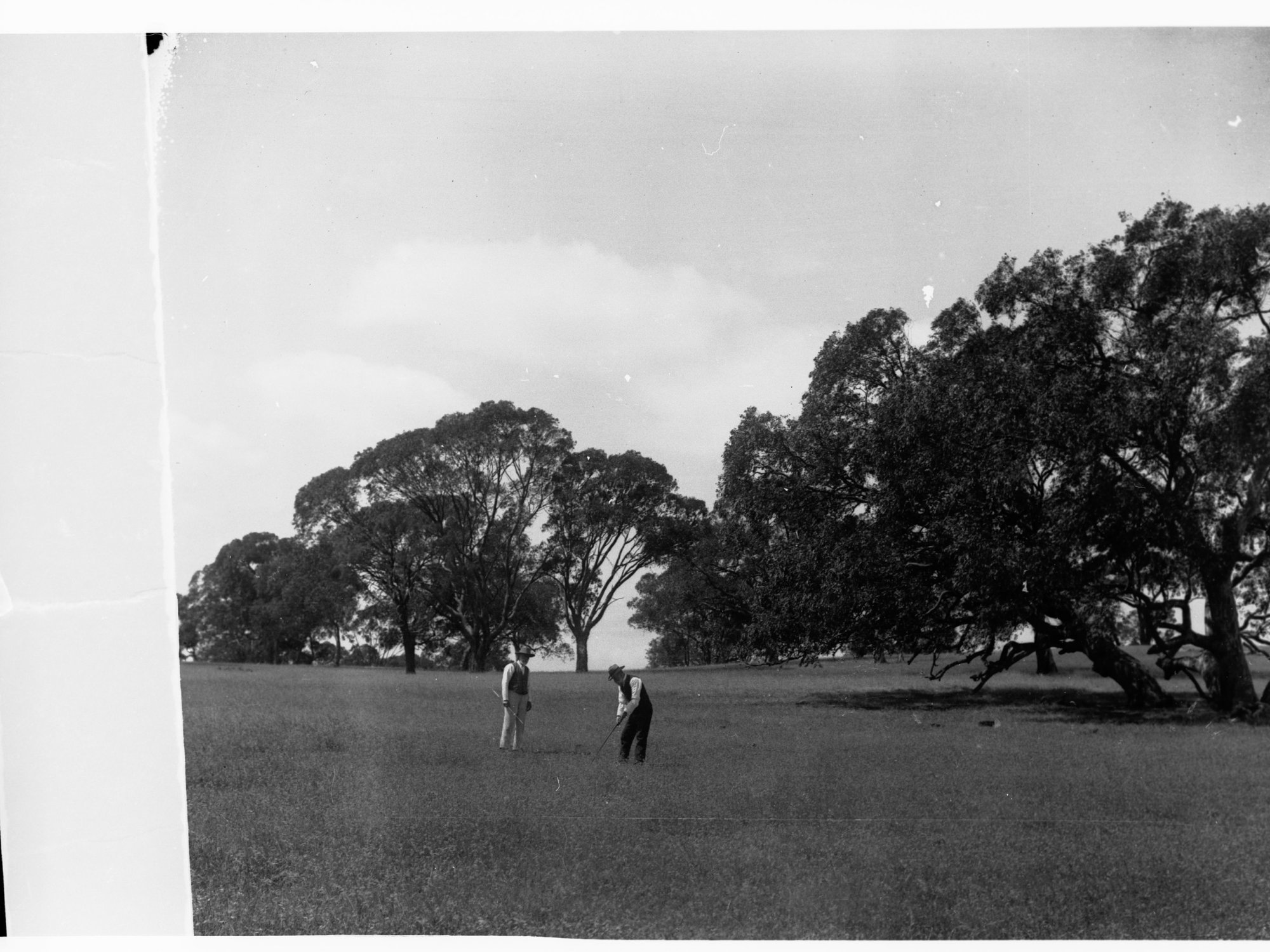 Men on golf links at Clare