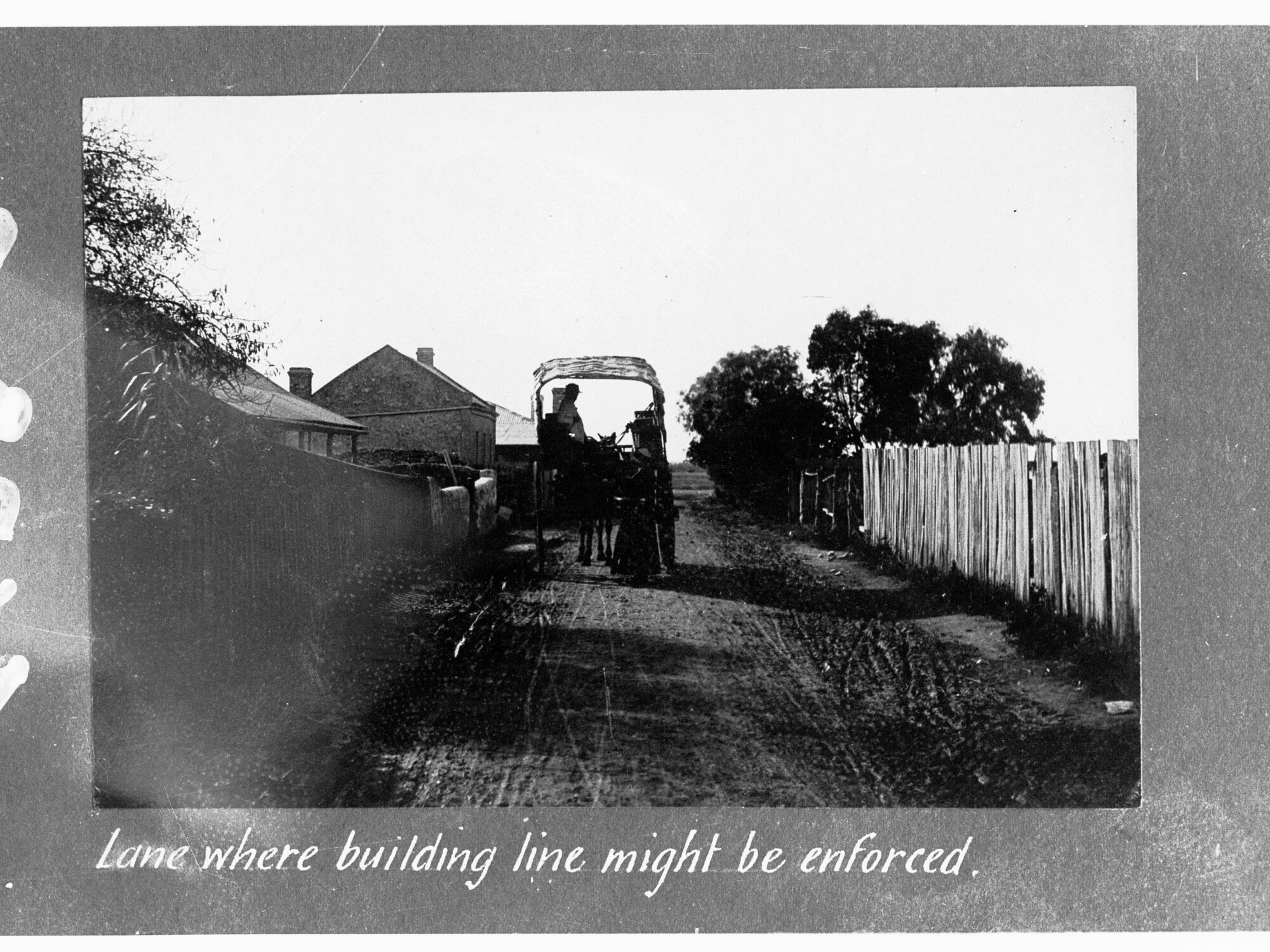 Lane where building line might be enforced - showing horse and cart with man in it