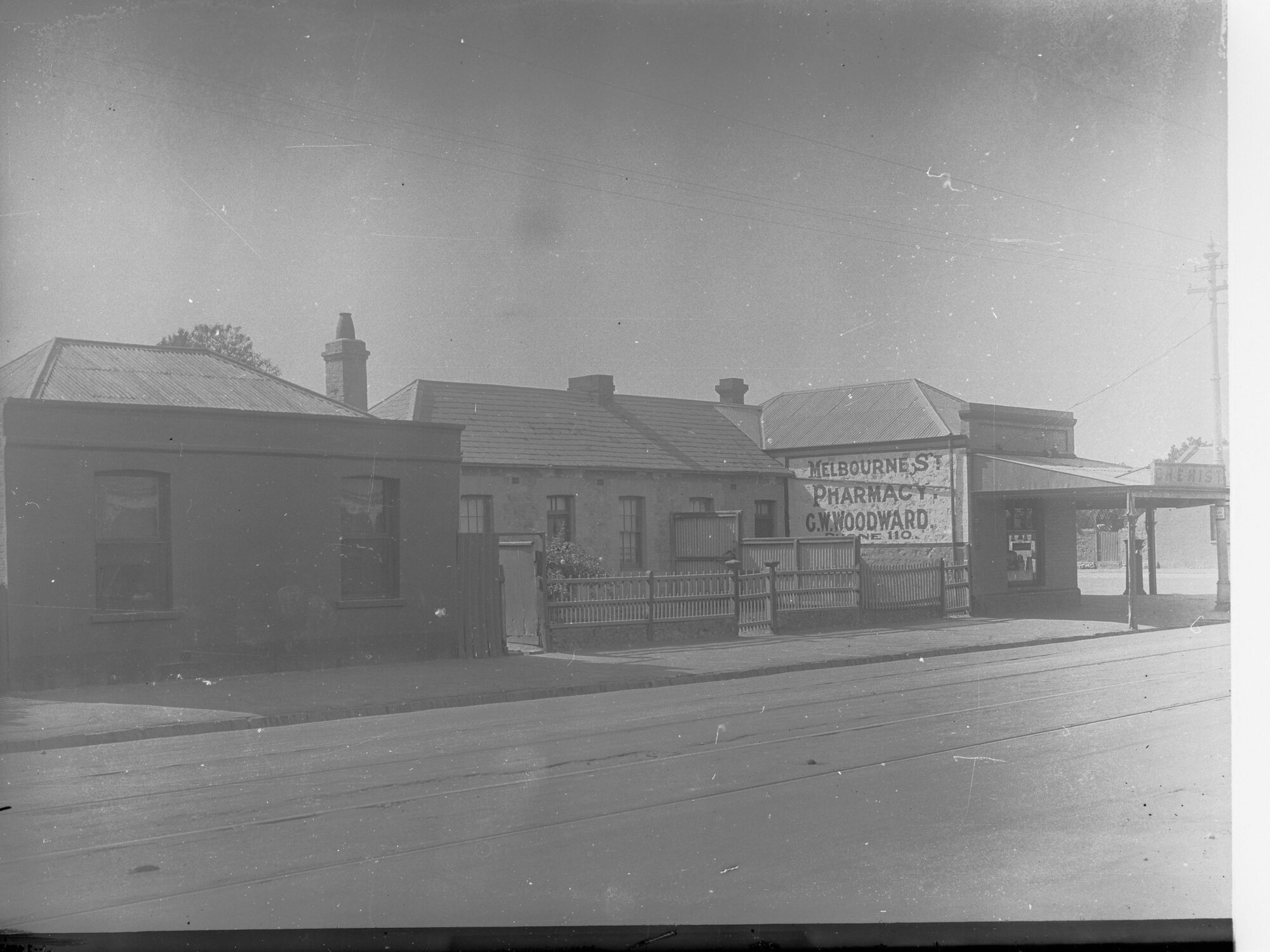 Melbourne Street, North Adelaide - West/Northern corner Jerningham Street - showing Pharmacy C W Woodward