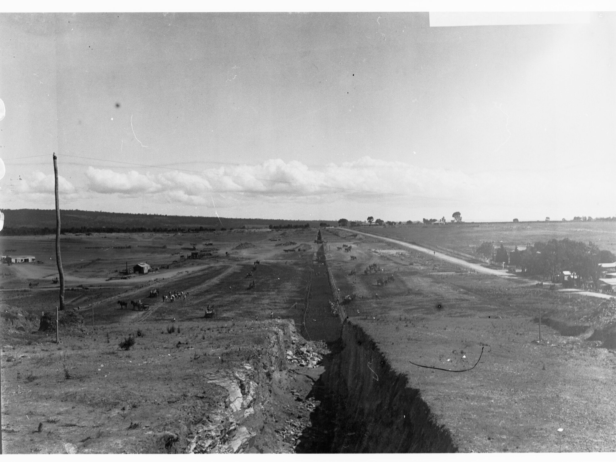 Happy Valley dam wall - clearing ground for base of wall - excavated puddle trench, horses at work