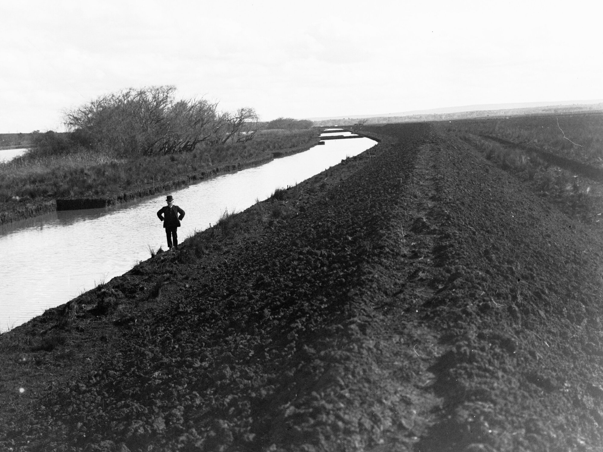 Man standing alongside South Eastern Drainage channels