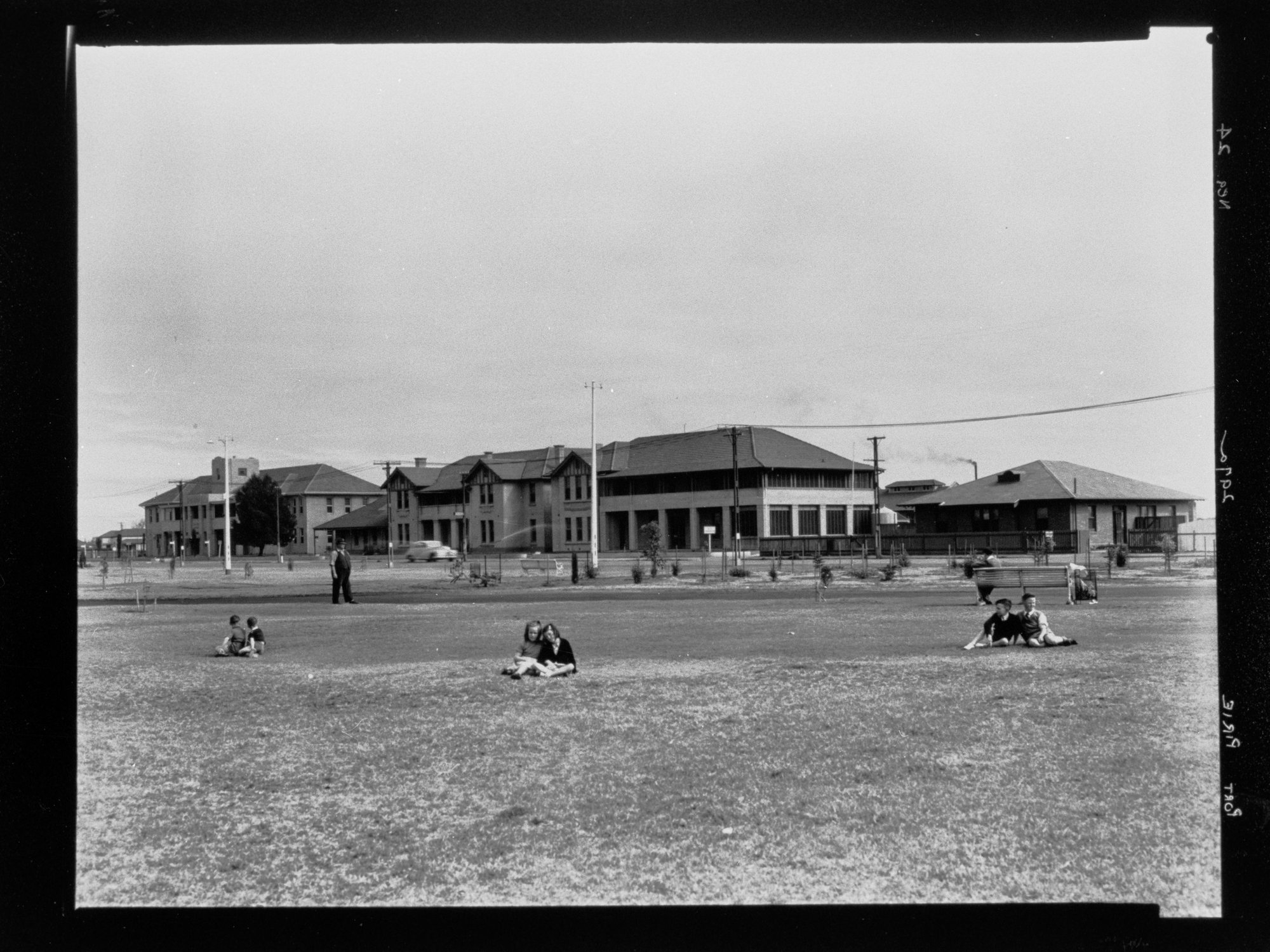 Port Pirie - groups of children sitting on grass reserve
