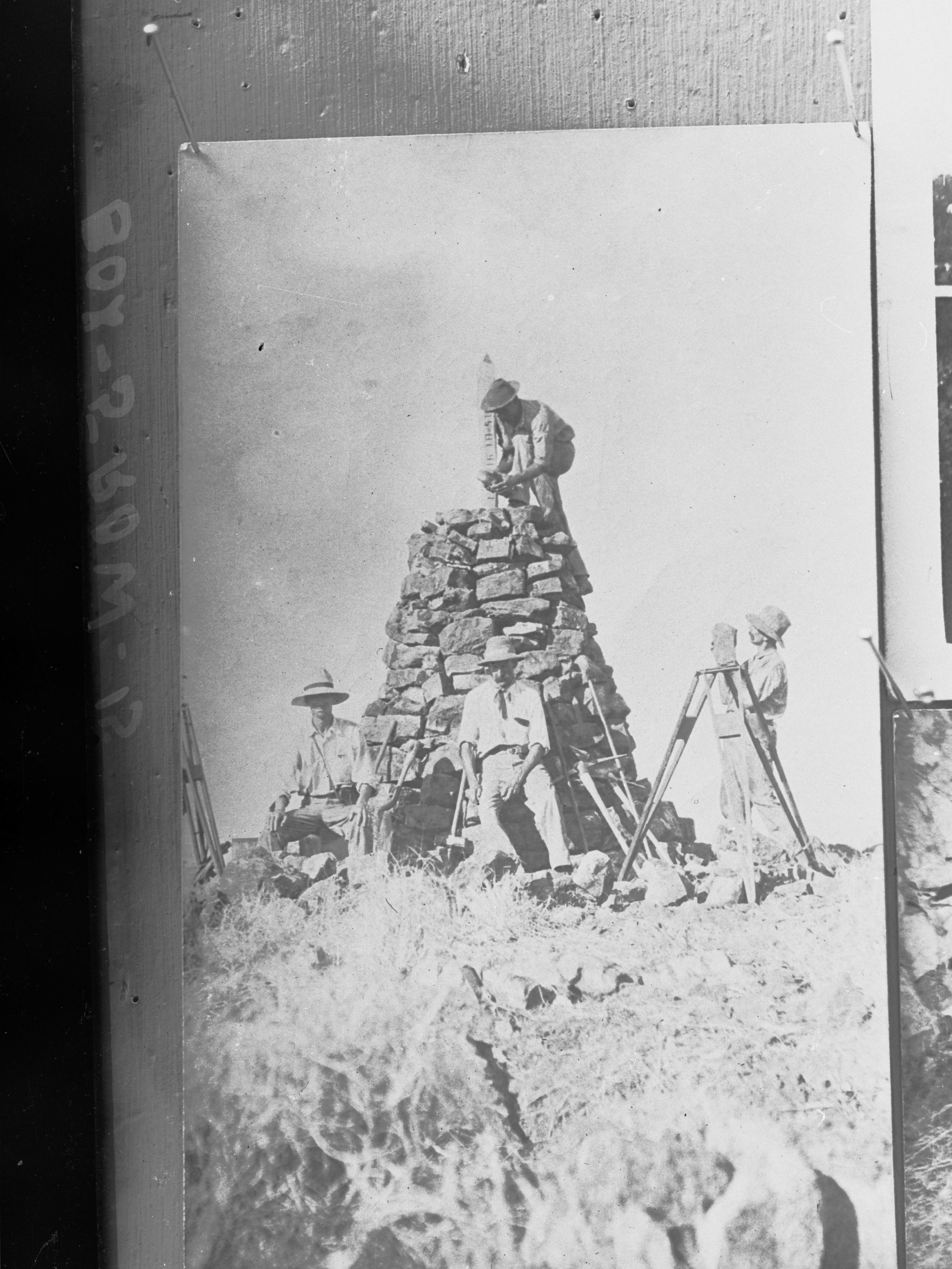 Construction of a stone cairn,  Calvert Expedition, 1896