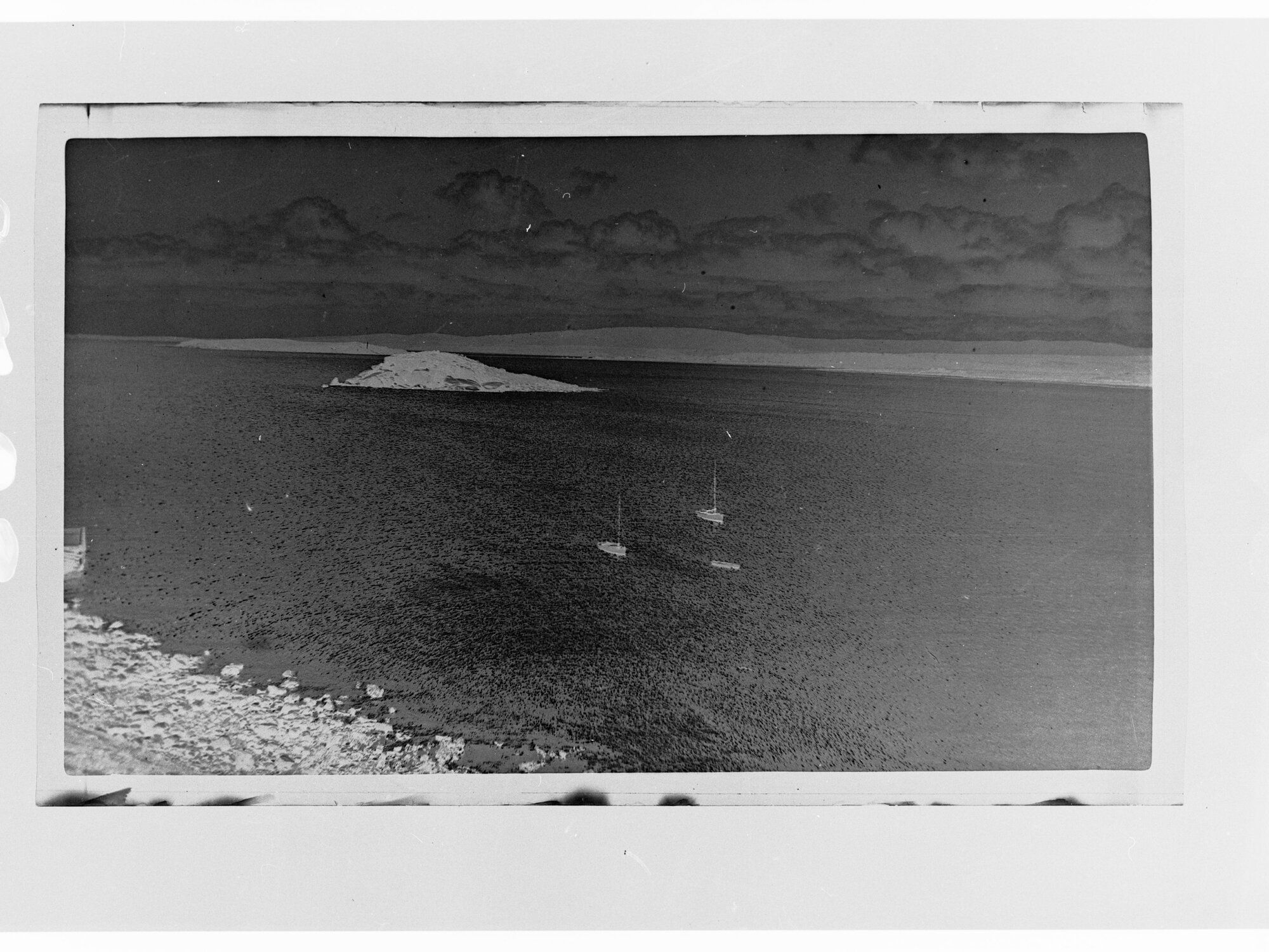 Sailboats on a harbour - island in the harbour - area unknown