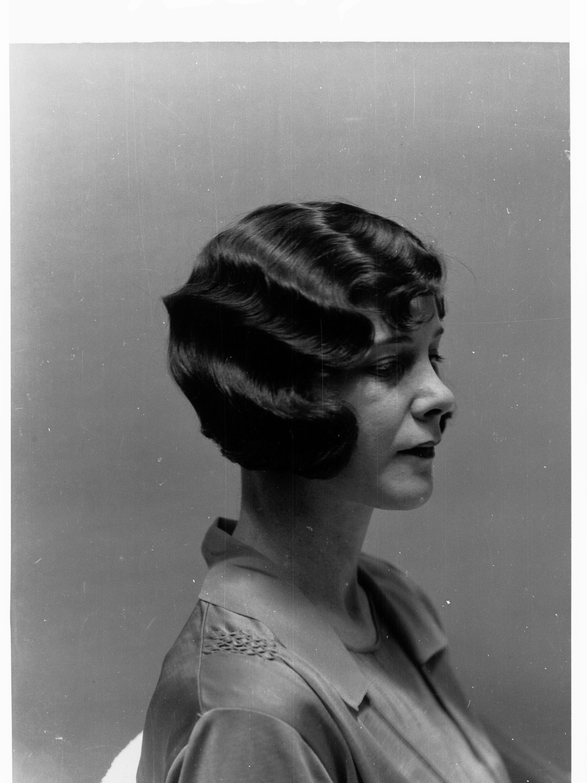 Portrait of a woman showing hairstyle done at Mitzi's Hairdressers, Adelaide Station