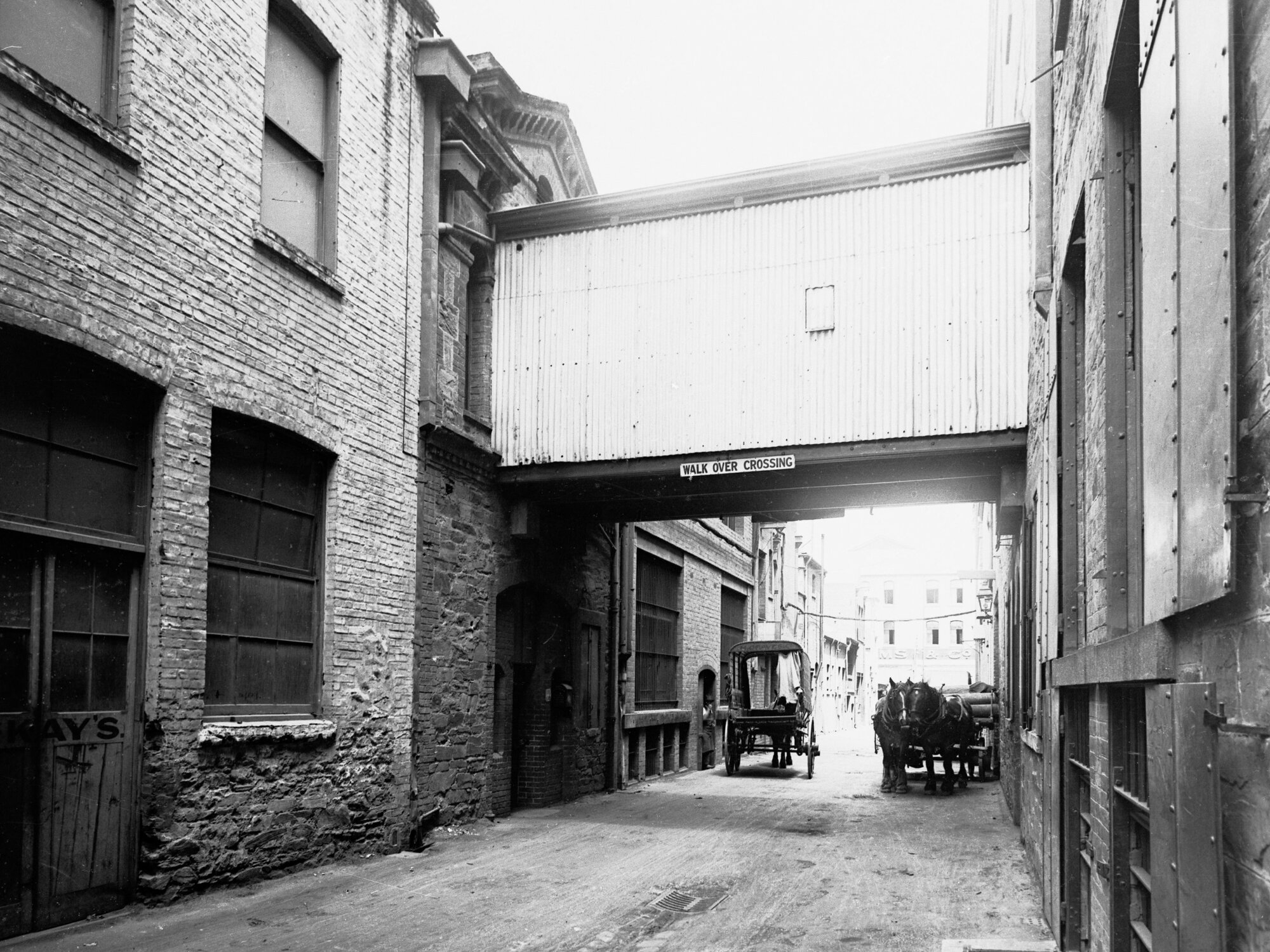 Overway bridge of  G &amp; R Wills and Co showing two horses and carts in lane