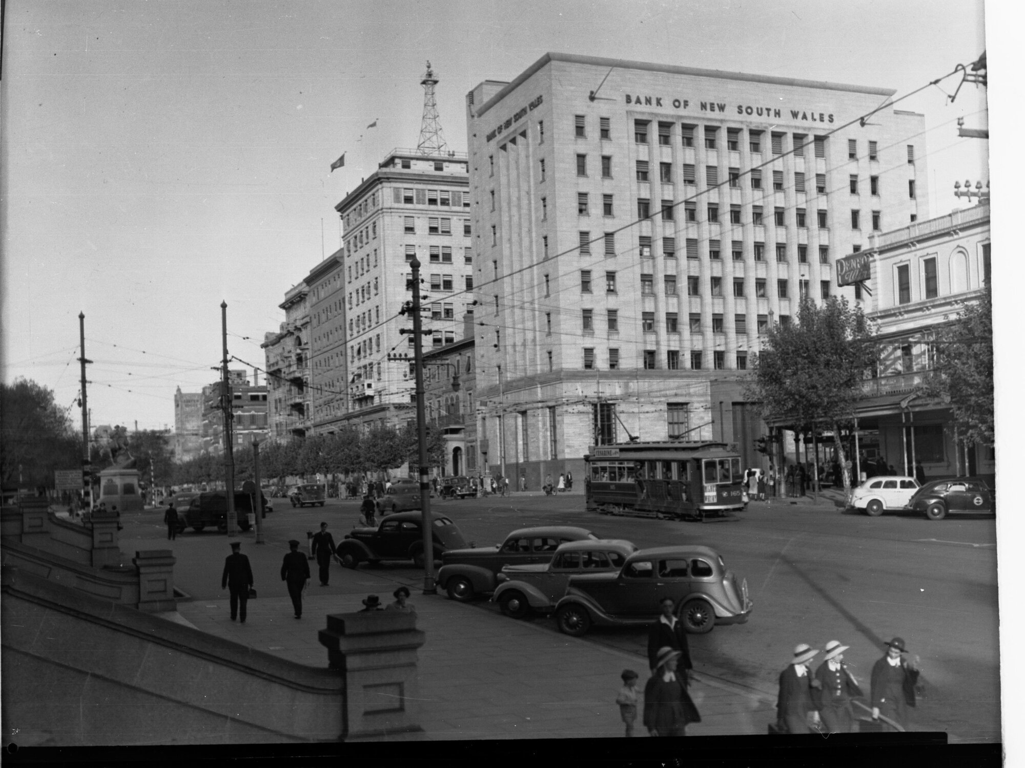 North Terrace showing trams, automobiles and people - Bank of New South Wales on the corner