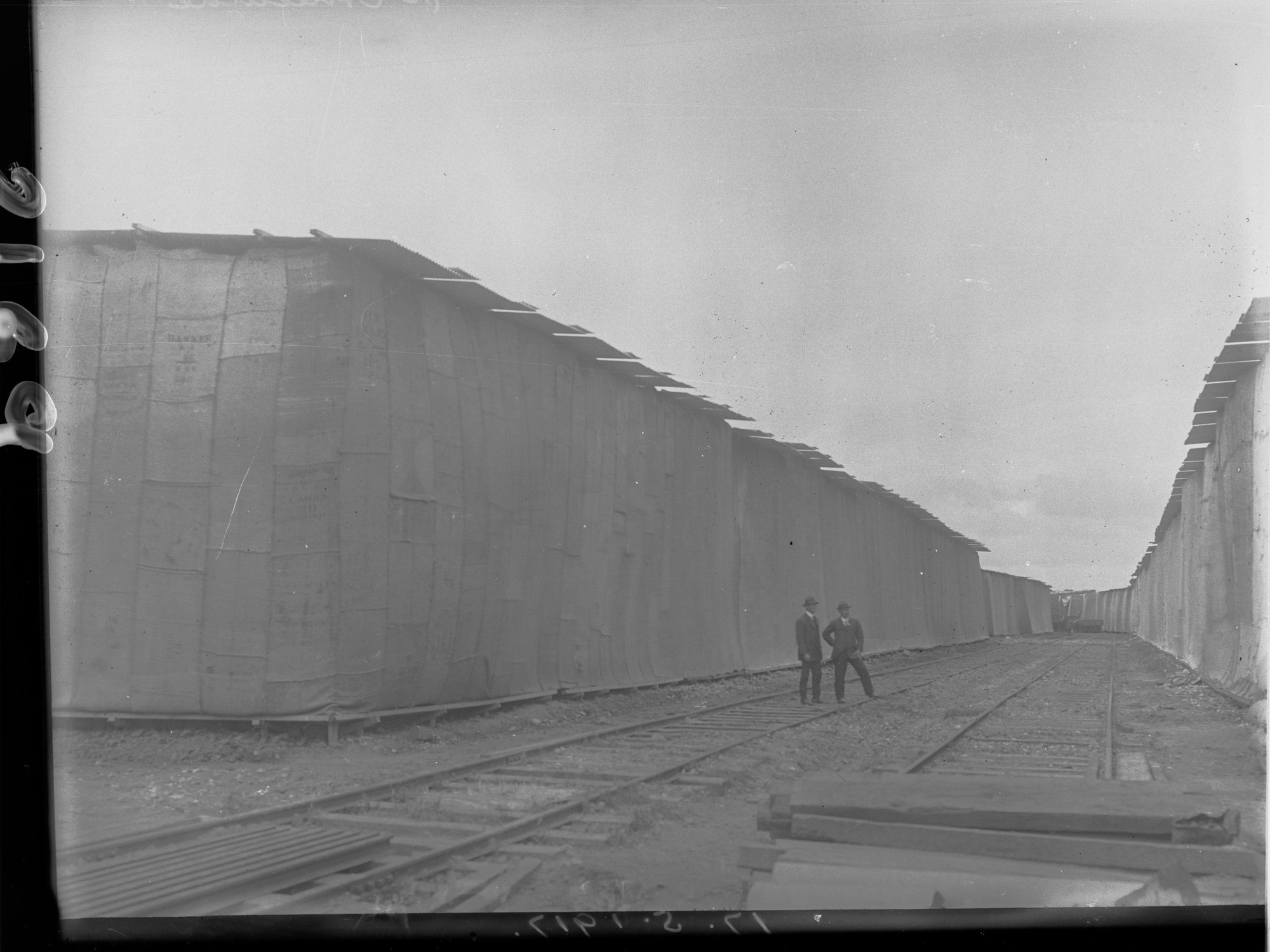 Port Adelaide Railway Line lined by  Wheat Stacks