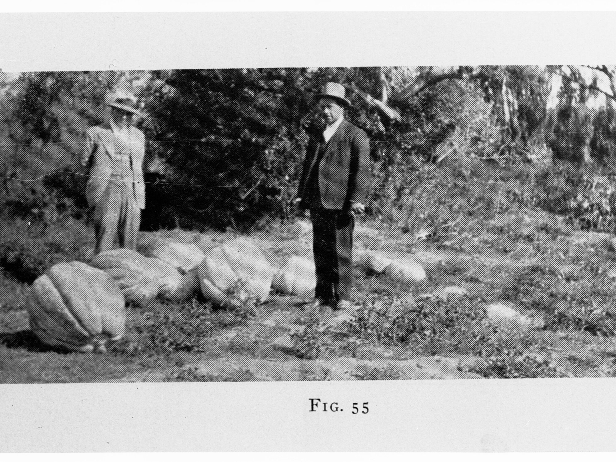 Farmers showing their crop of pumpkins