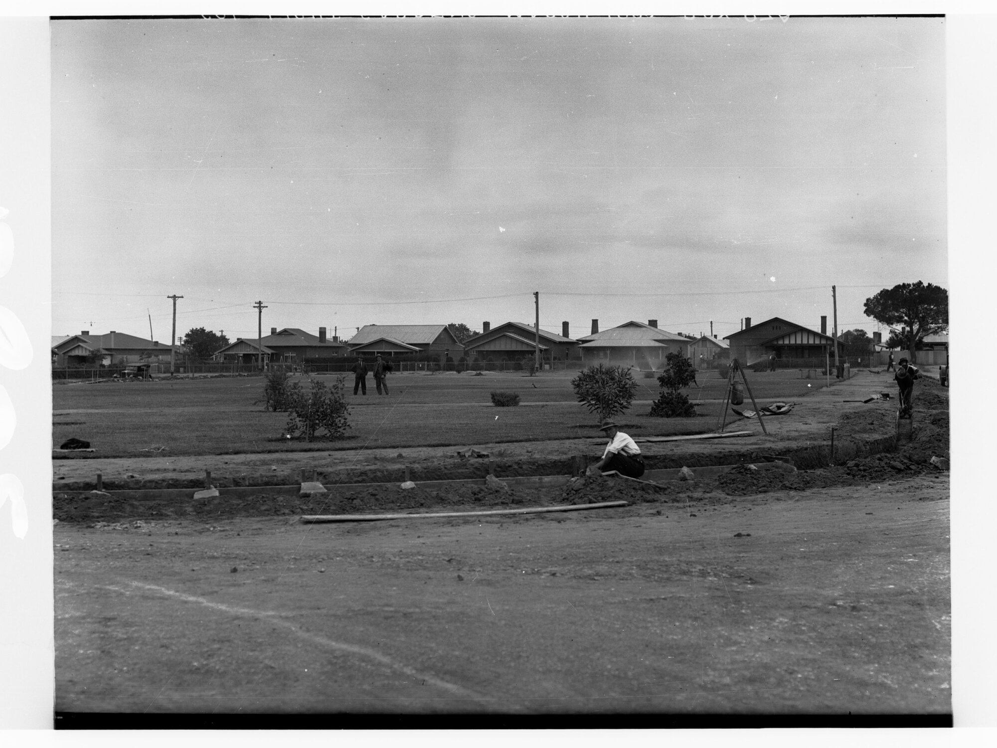 Housing at Colonel Light Gardens - showing men working on road