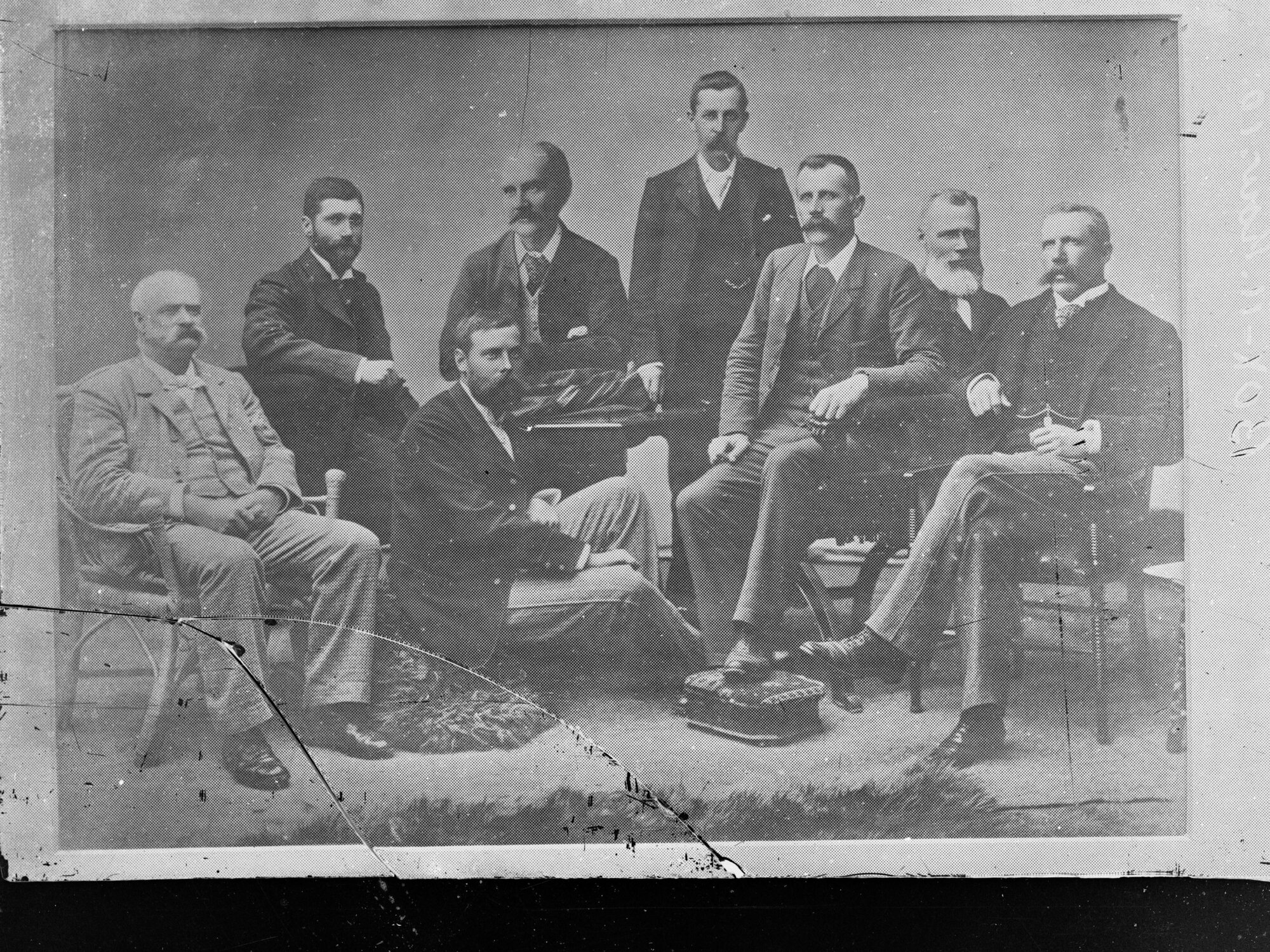 Group of men sitting posing for portrait