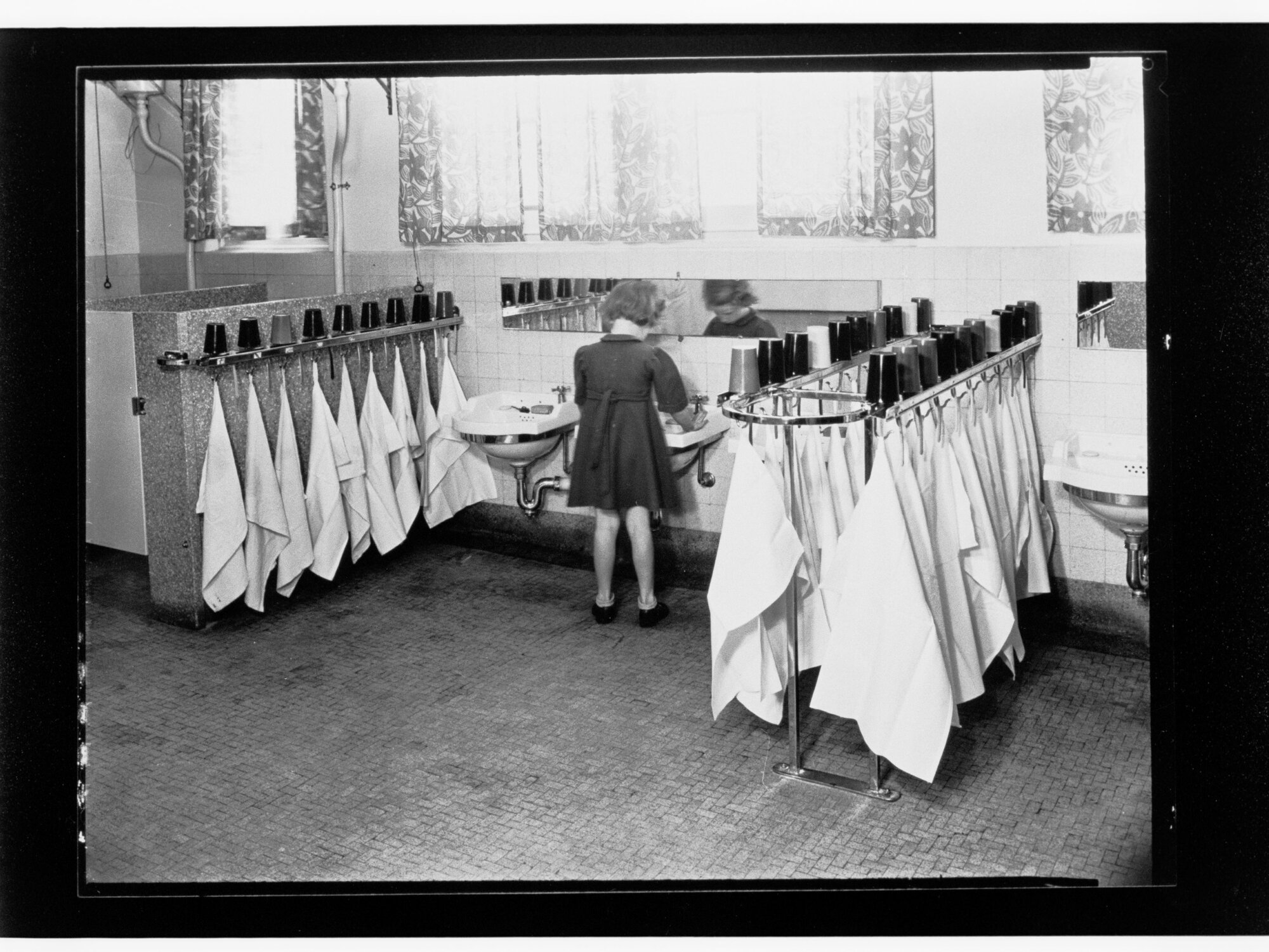 Children's Welfare Department - girl at hand basin in bathroom