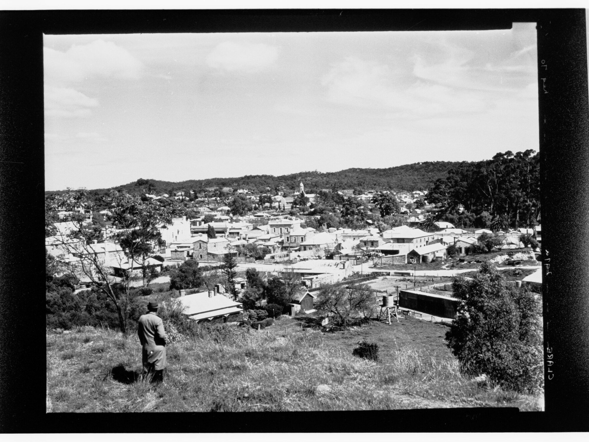 Clare - man on hill looking down towards town