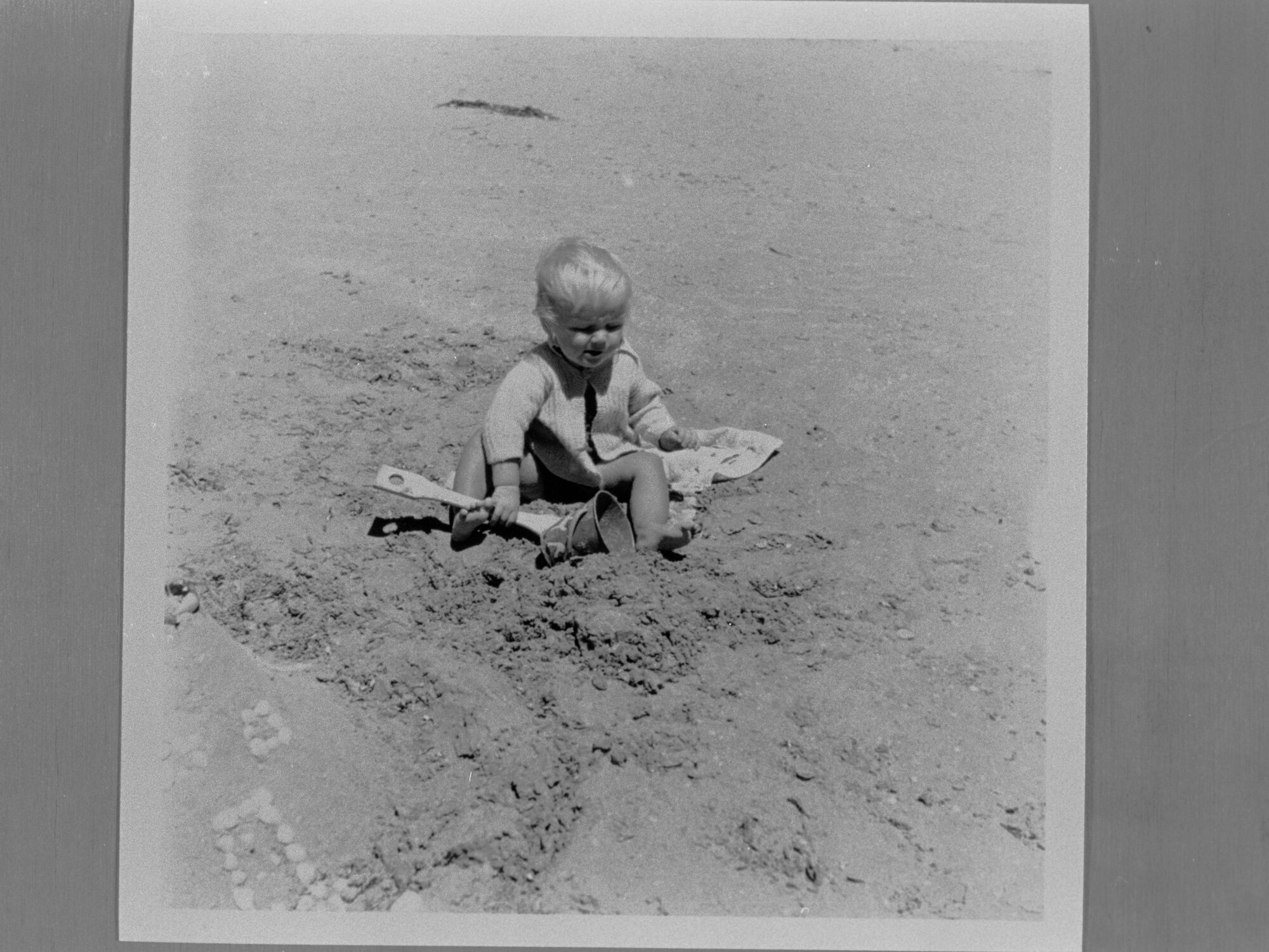 Small child playing in the sand