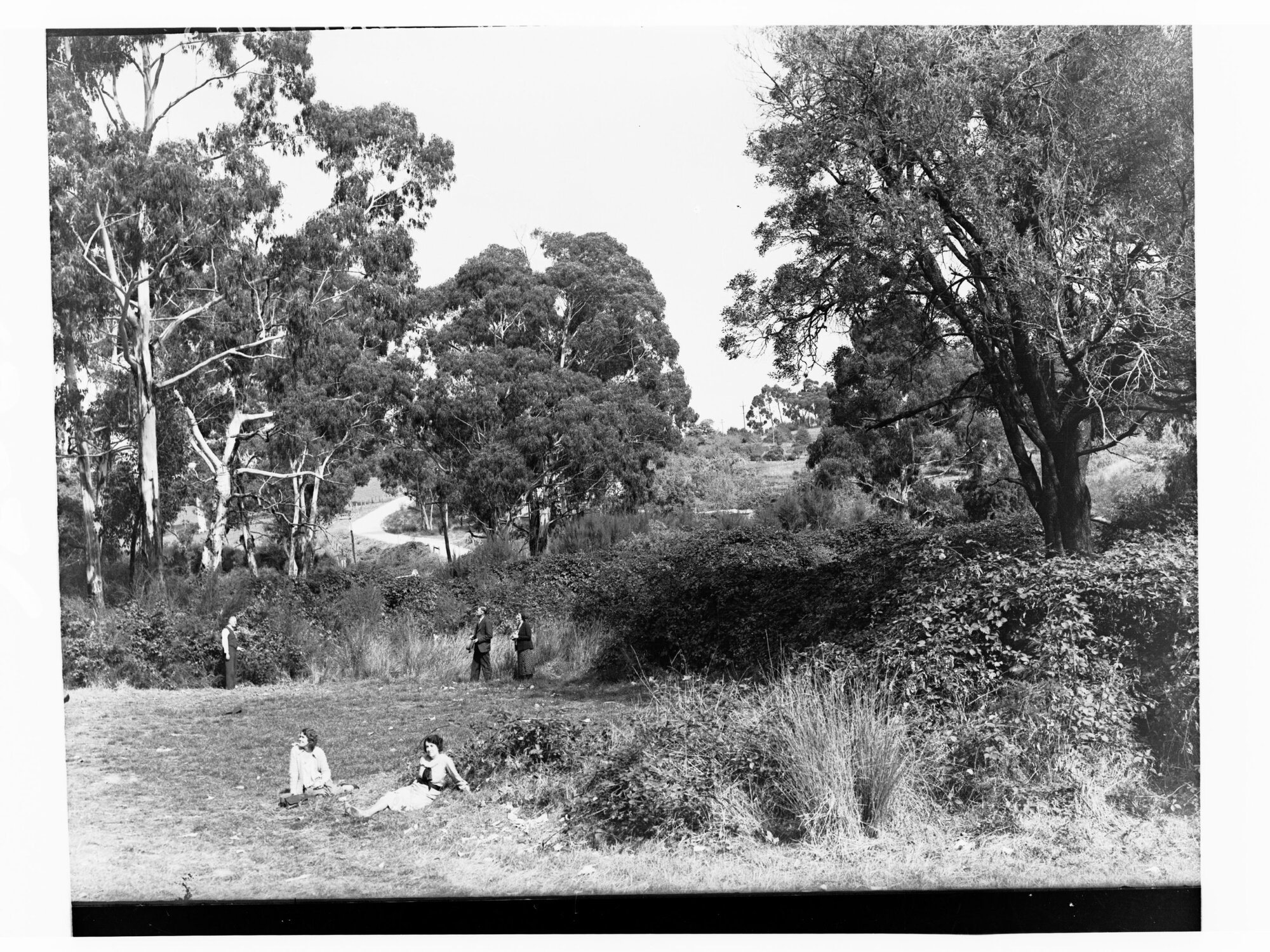 Men and women in a garden at Stirling