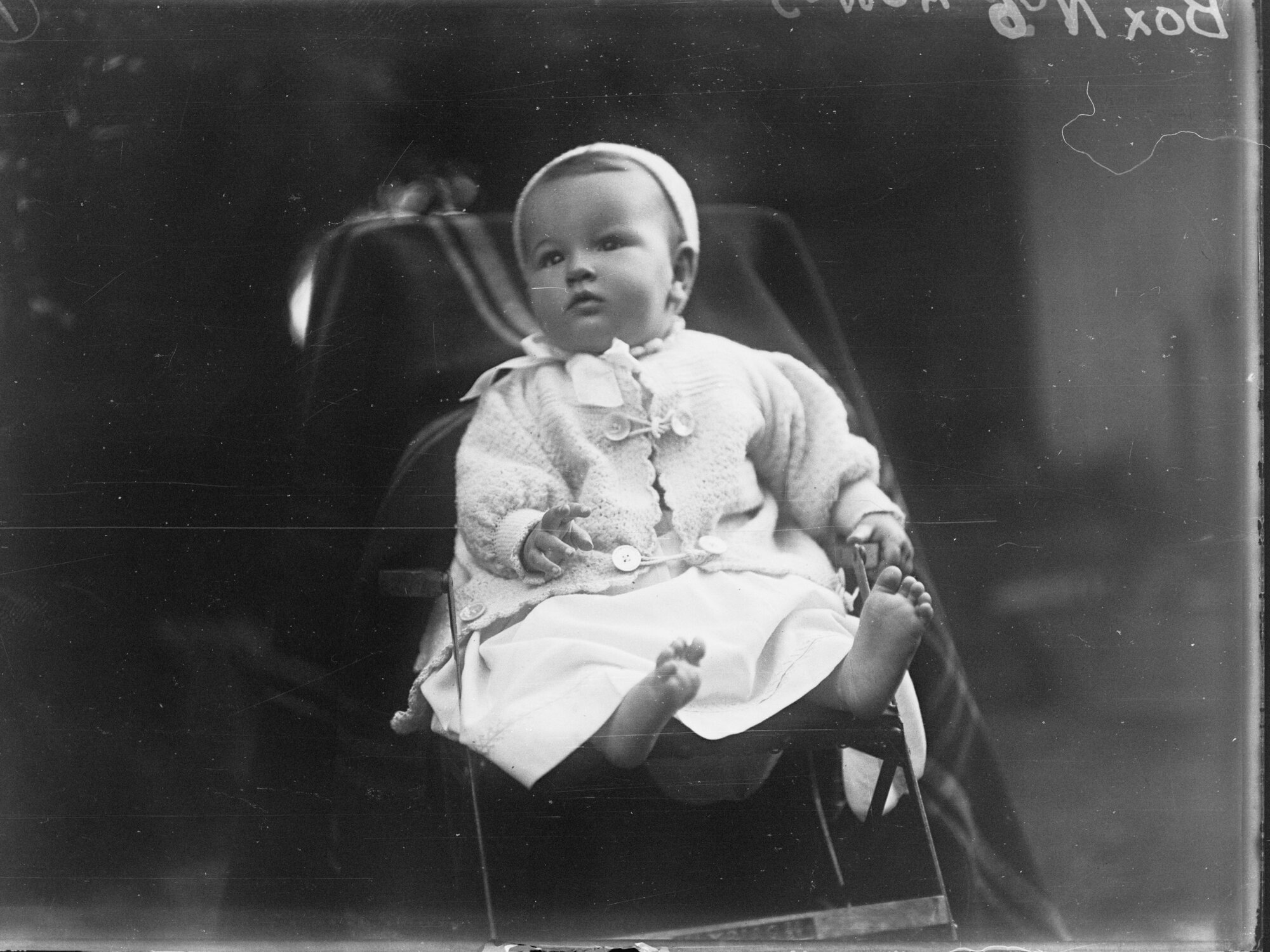 Baby sitting in garden 