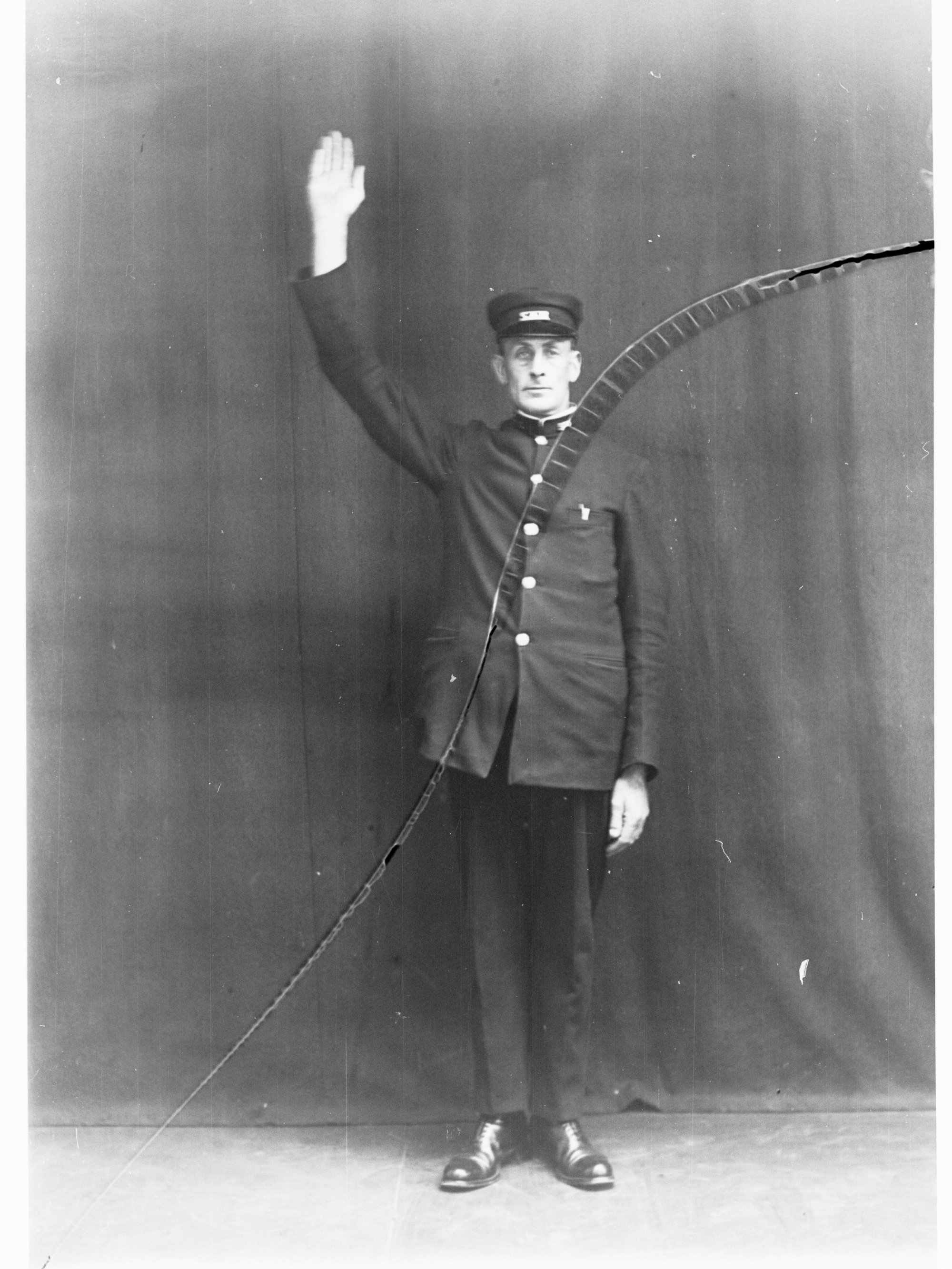 Porter demonstrating railway hand signals