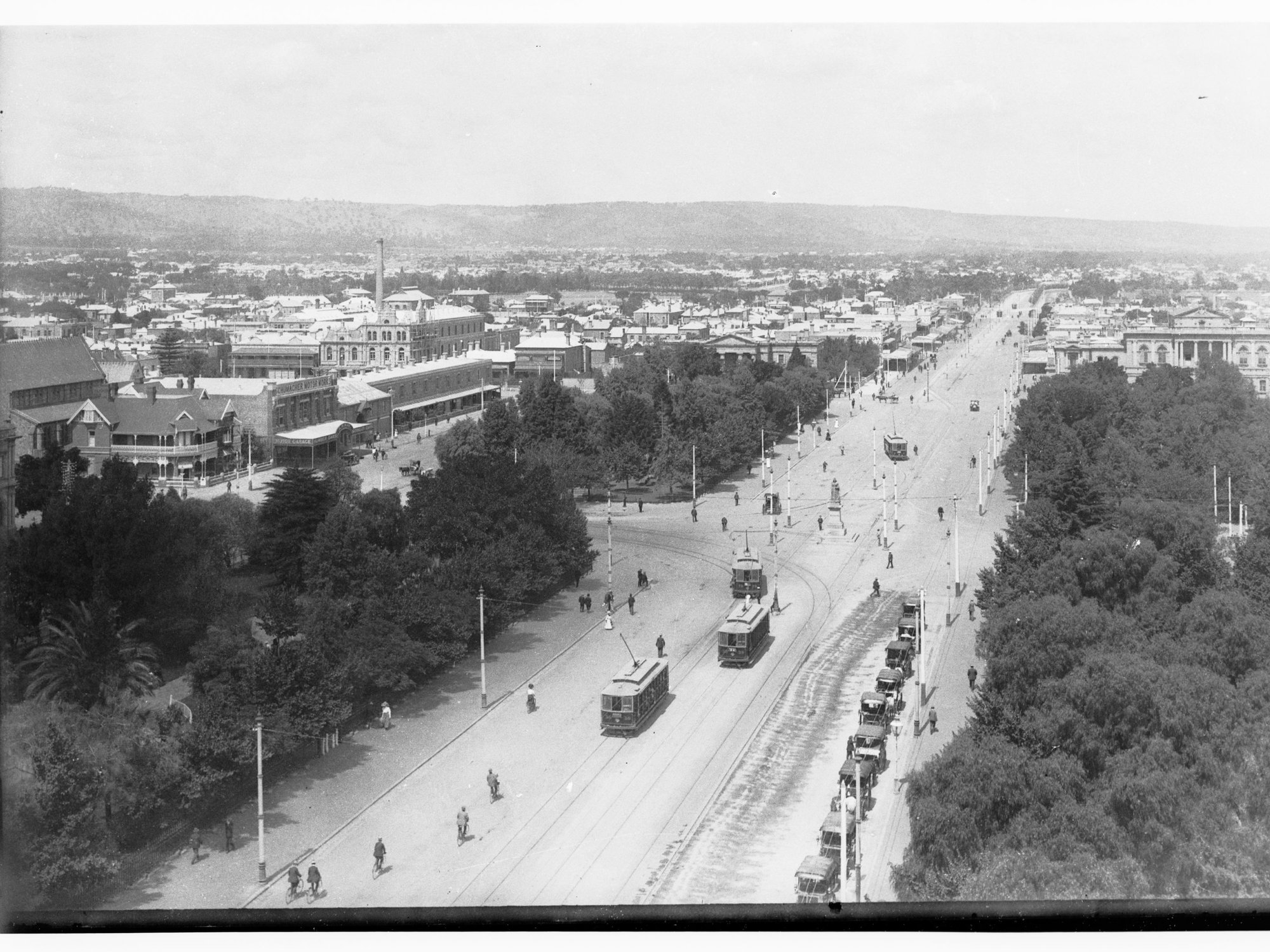 Victoria Square looking south - shows trams, automobiles and cyclists