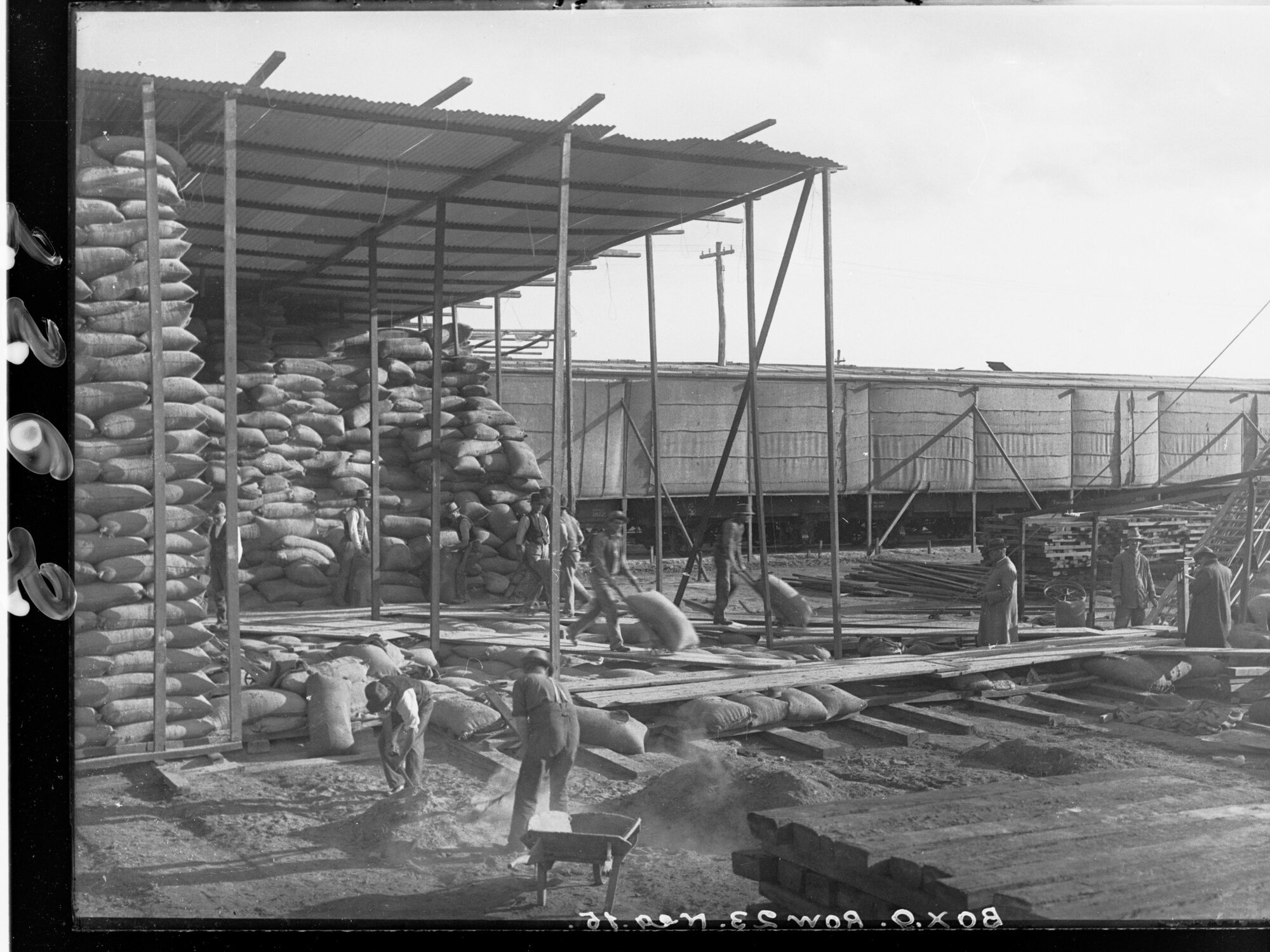 Men loading wheat sacks at Flour Mill Port Adelaide