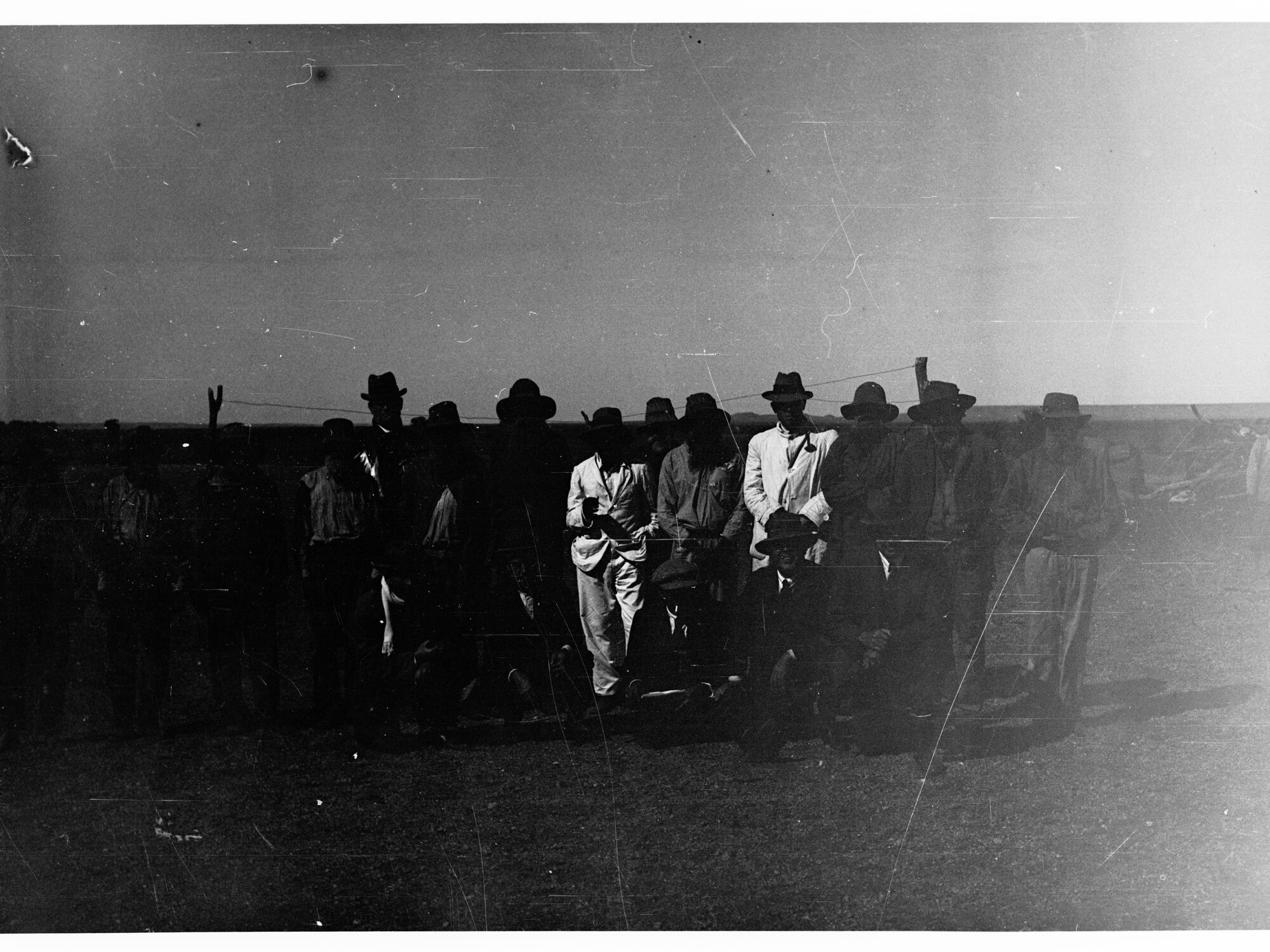 Parliamentary party on tour of Far North in Austin cars (government cars) - shows men standing lined up for photograph