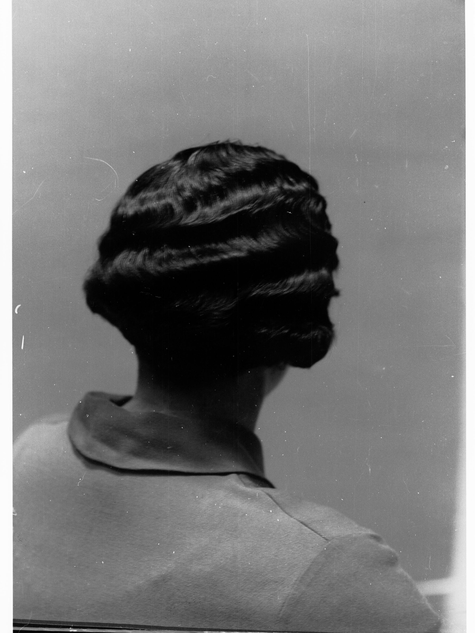 Portrait of a woman showing hairstyle done at Mitzi's Hairdressers, Adelaide Station