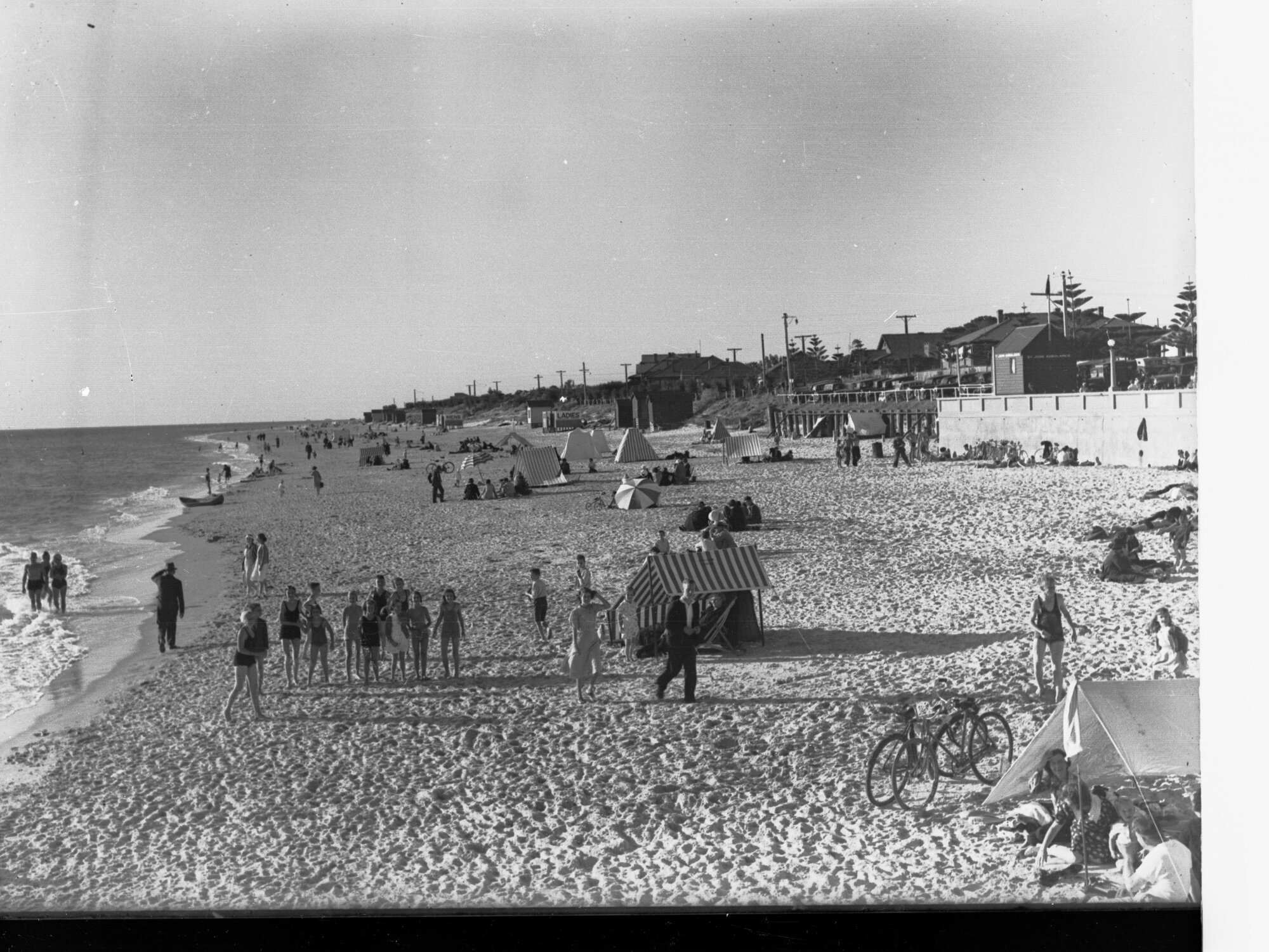 Brighton Beach Showing People on Beach in Swimsuits