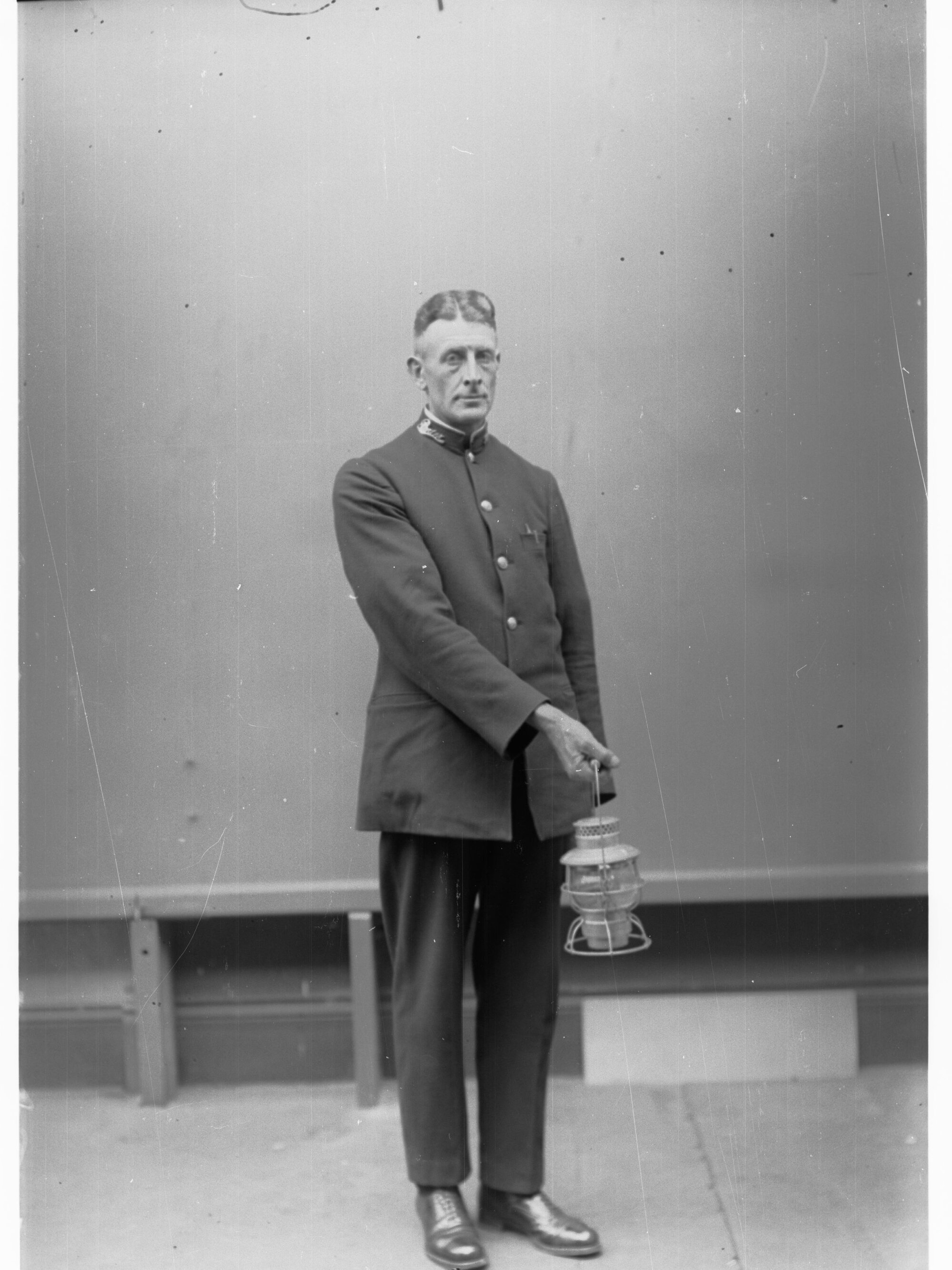 Porter demonstrating railway lantern signals