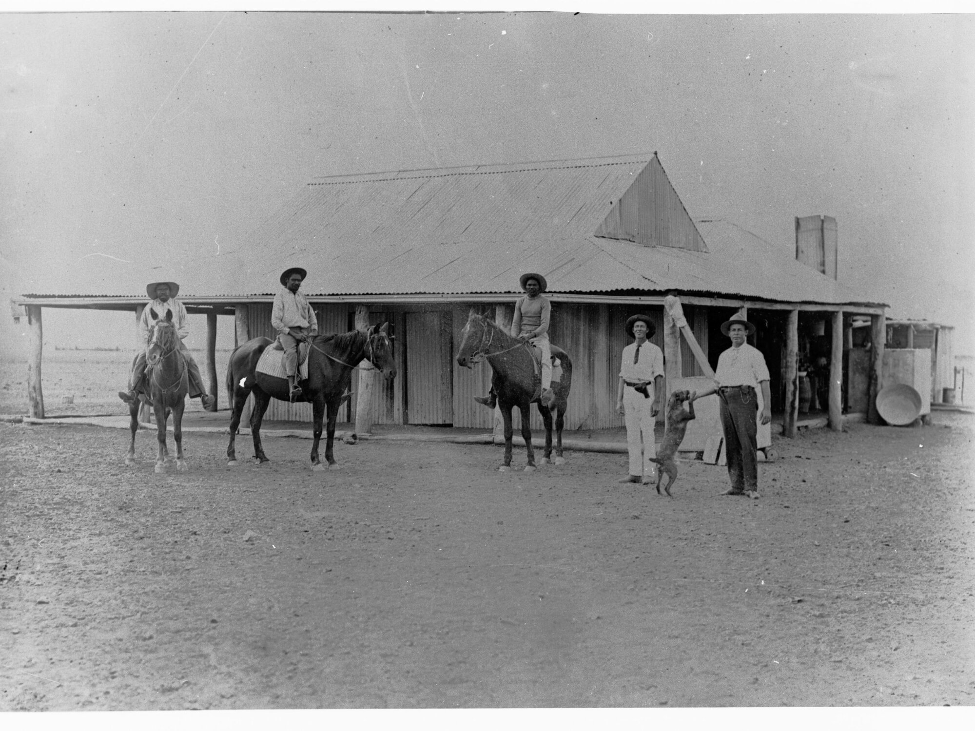 Anthony's Lagoon Police Station - Northern Territory (showing cattlemen on horses in front of police station)