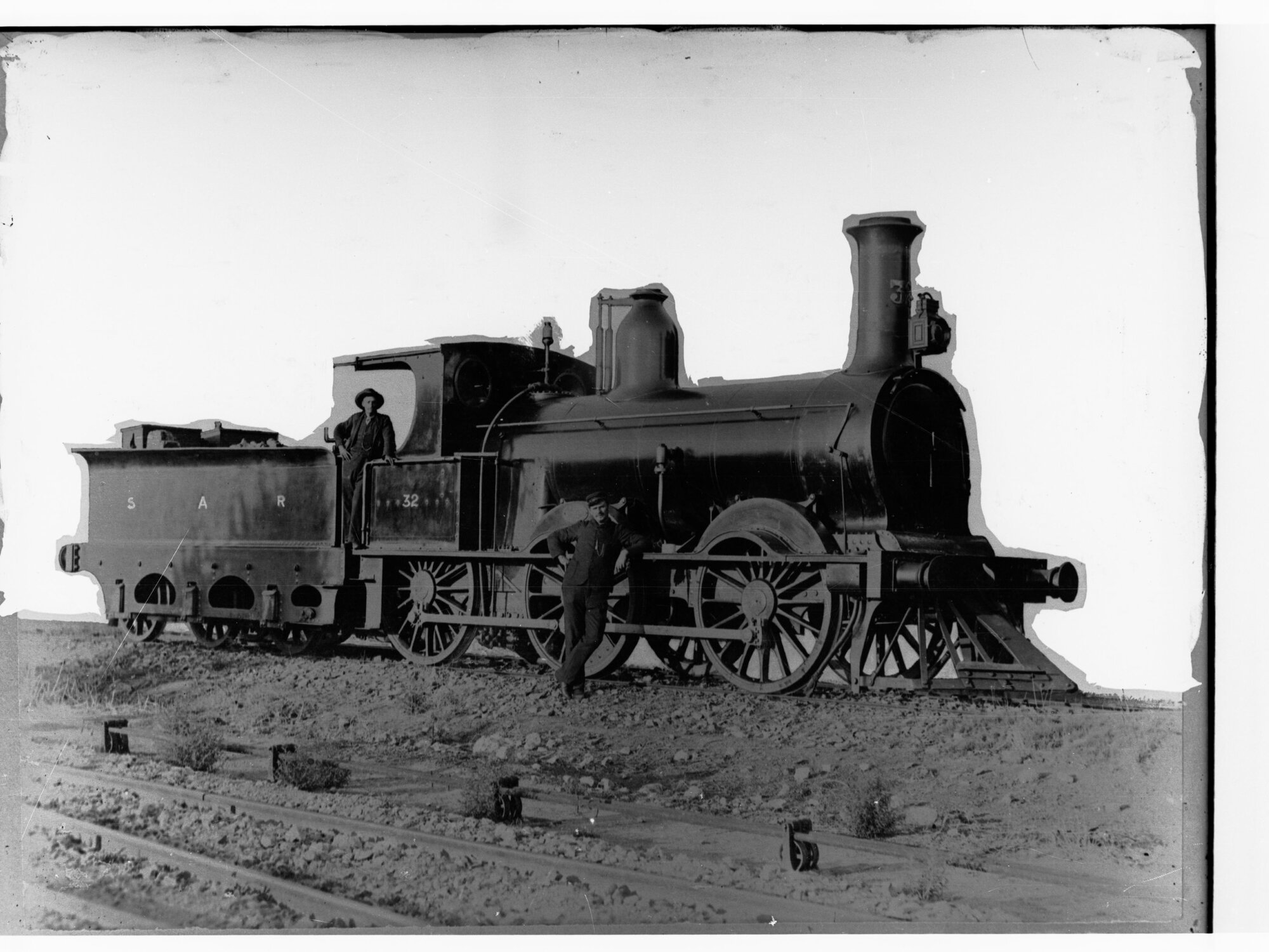 Steam locomotive showing two men