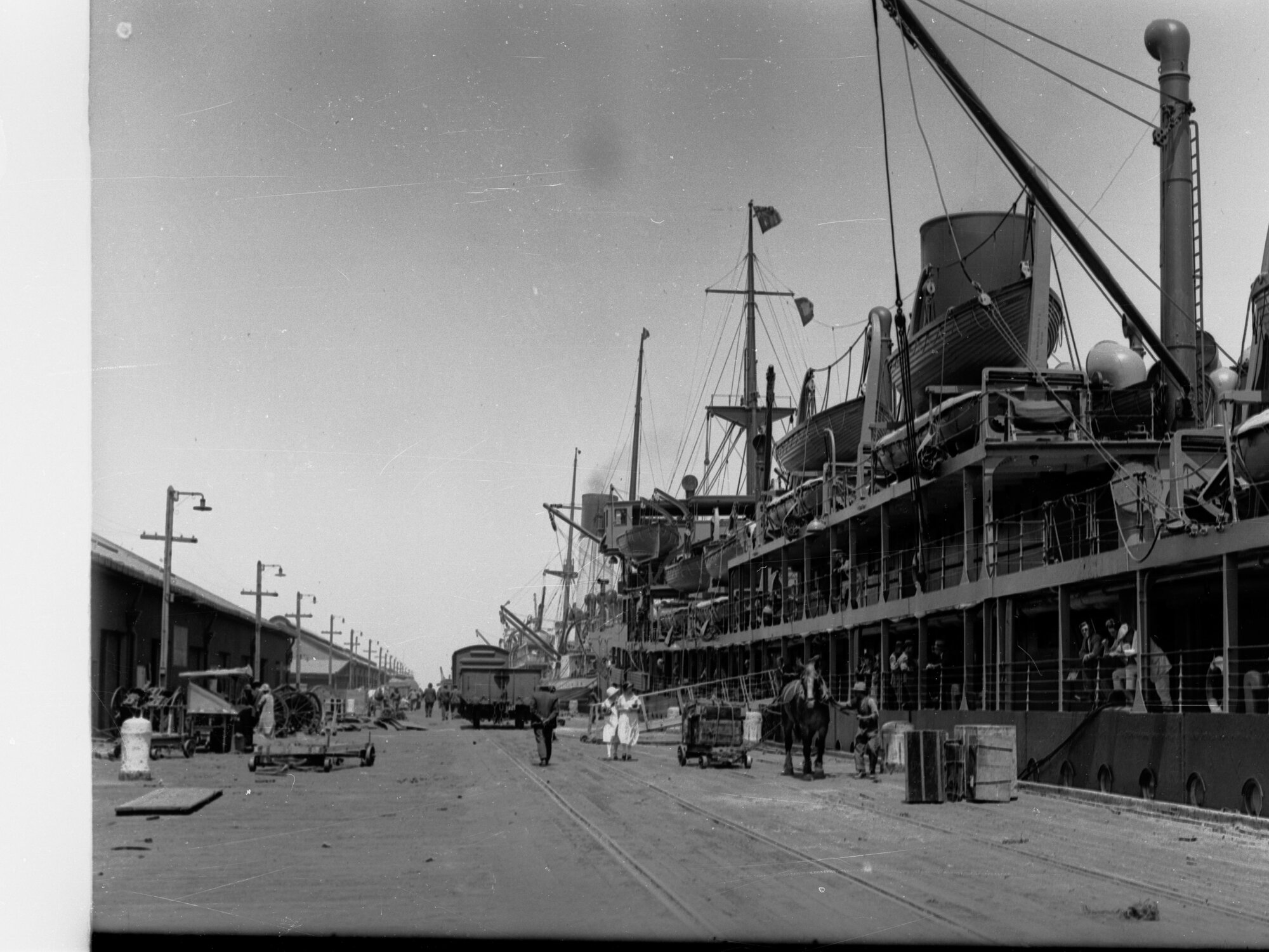 Ship at Outer Harbour Showing Activity on Wharf