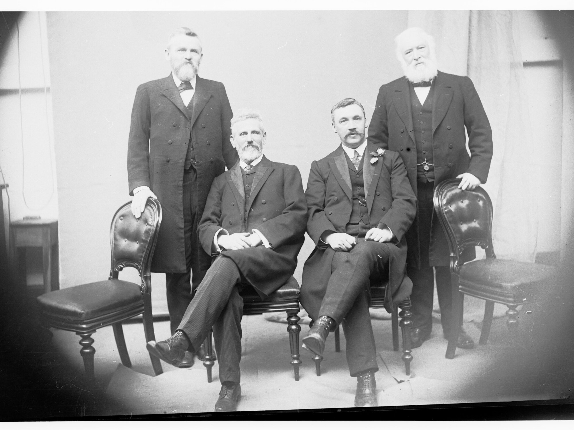 Group photograph of Price Ministry - left to right: L O'Loughlin, T Price, A H Peake and A A Kirkpatrick,