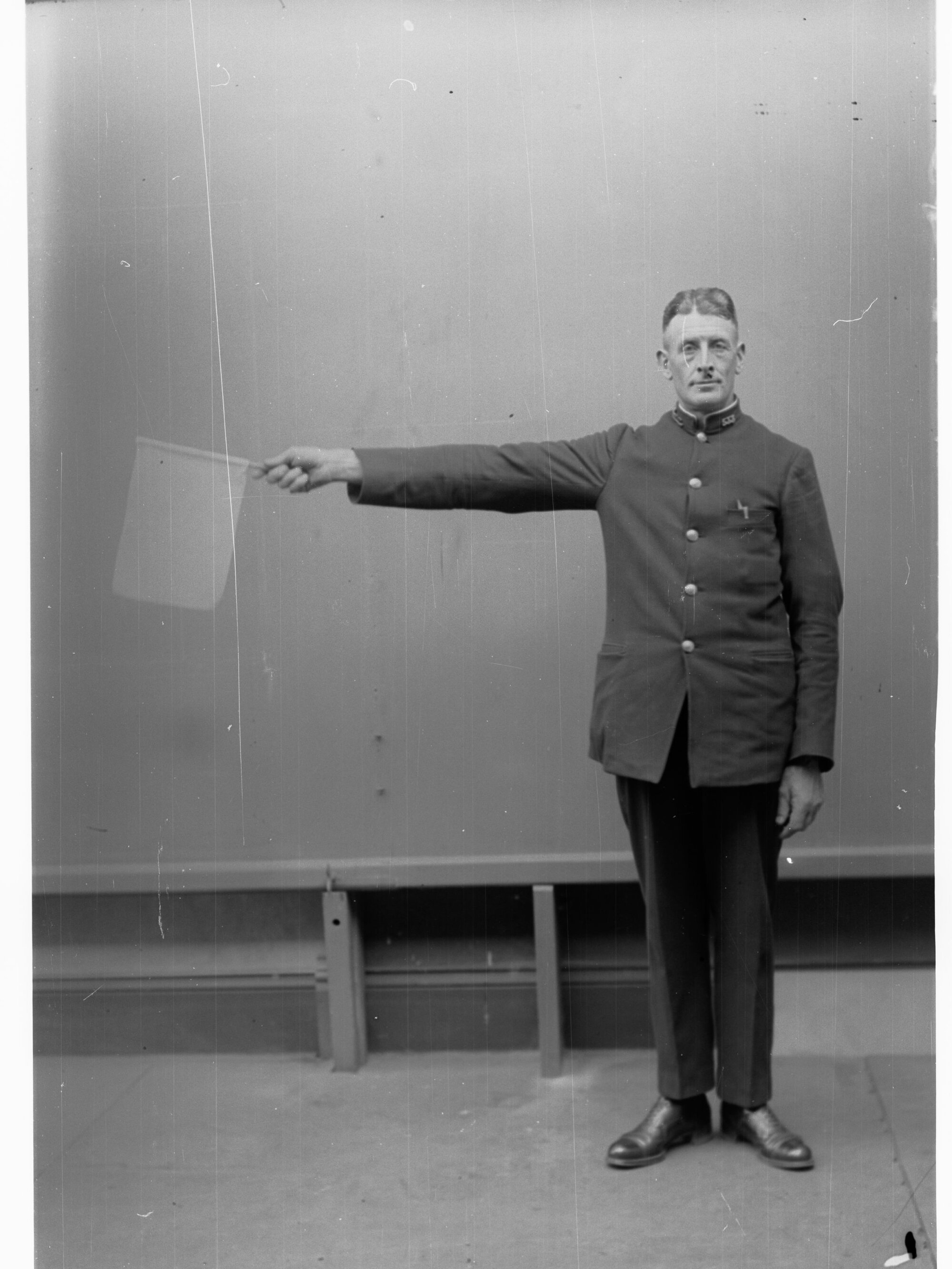 Porter demonstrating railway hand signals