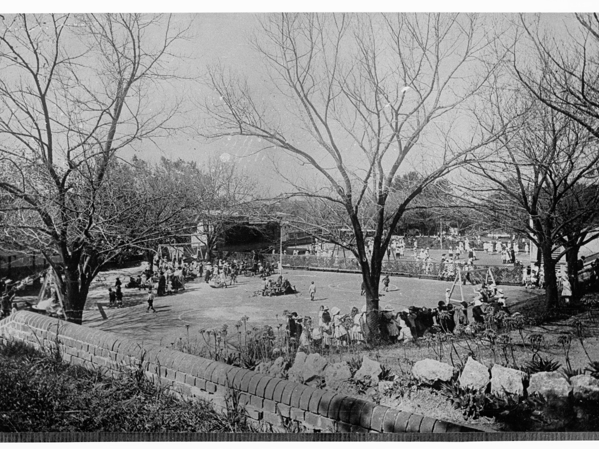Playground in a school - showing children playing sport