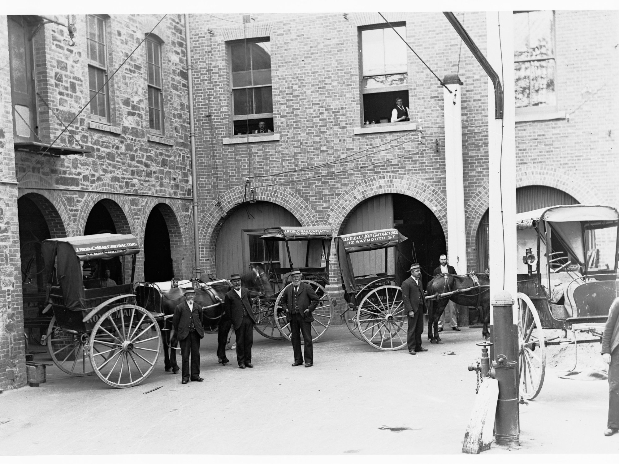 Courtyard of General Post Office, Adelaide - showing men and horsedrawn carts (J Reid &amp; Co. Mail Contractors, 42 Waymouth Street)