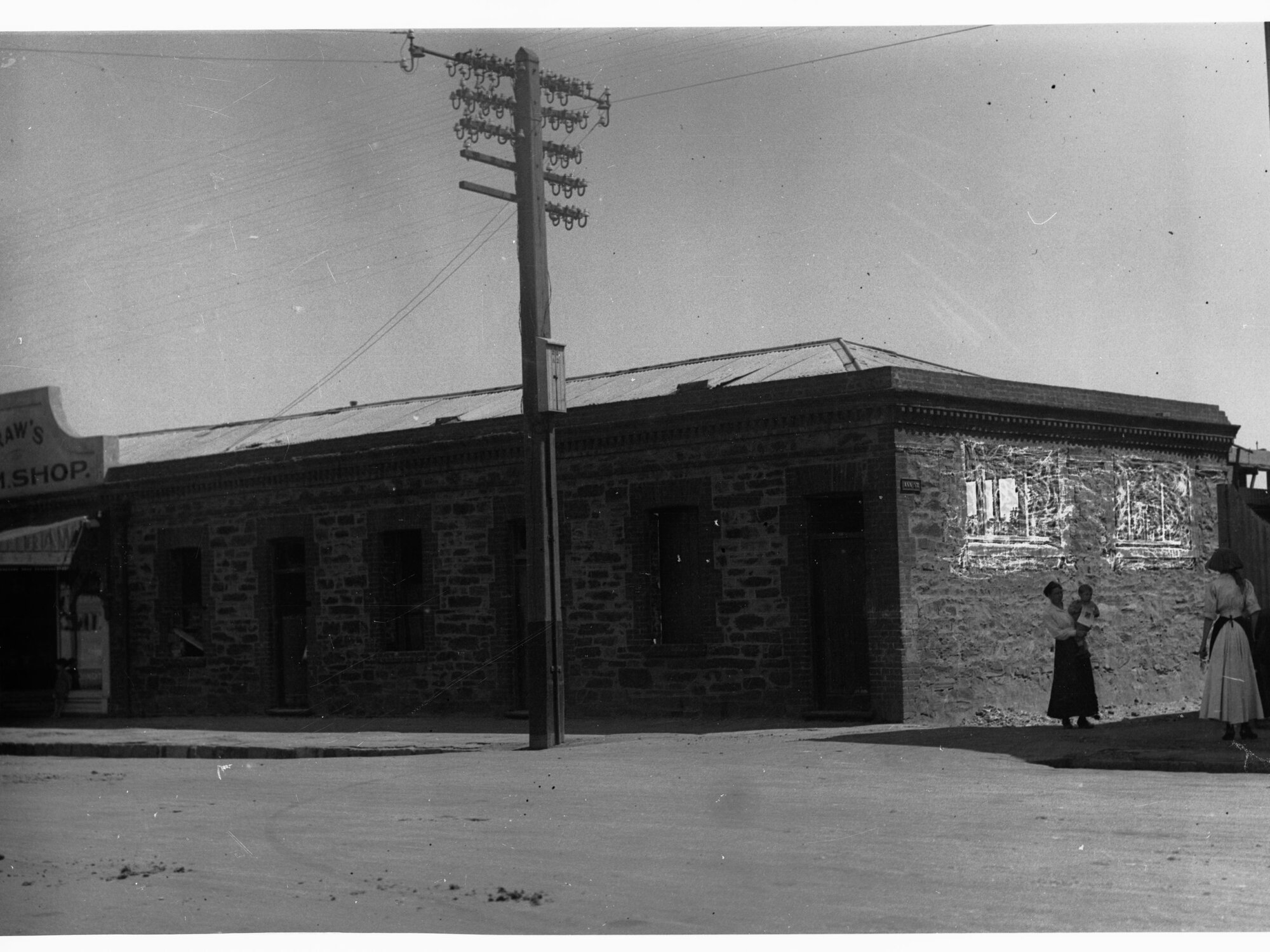 Building on the corner of Ann Street and Waymouth Street - W.H. Raw's ham and beef shop on the left