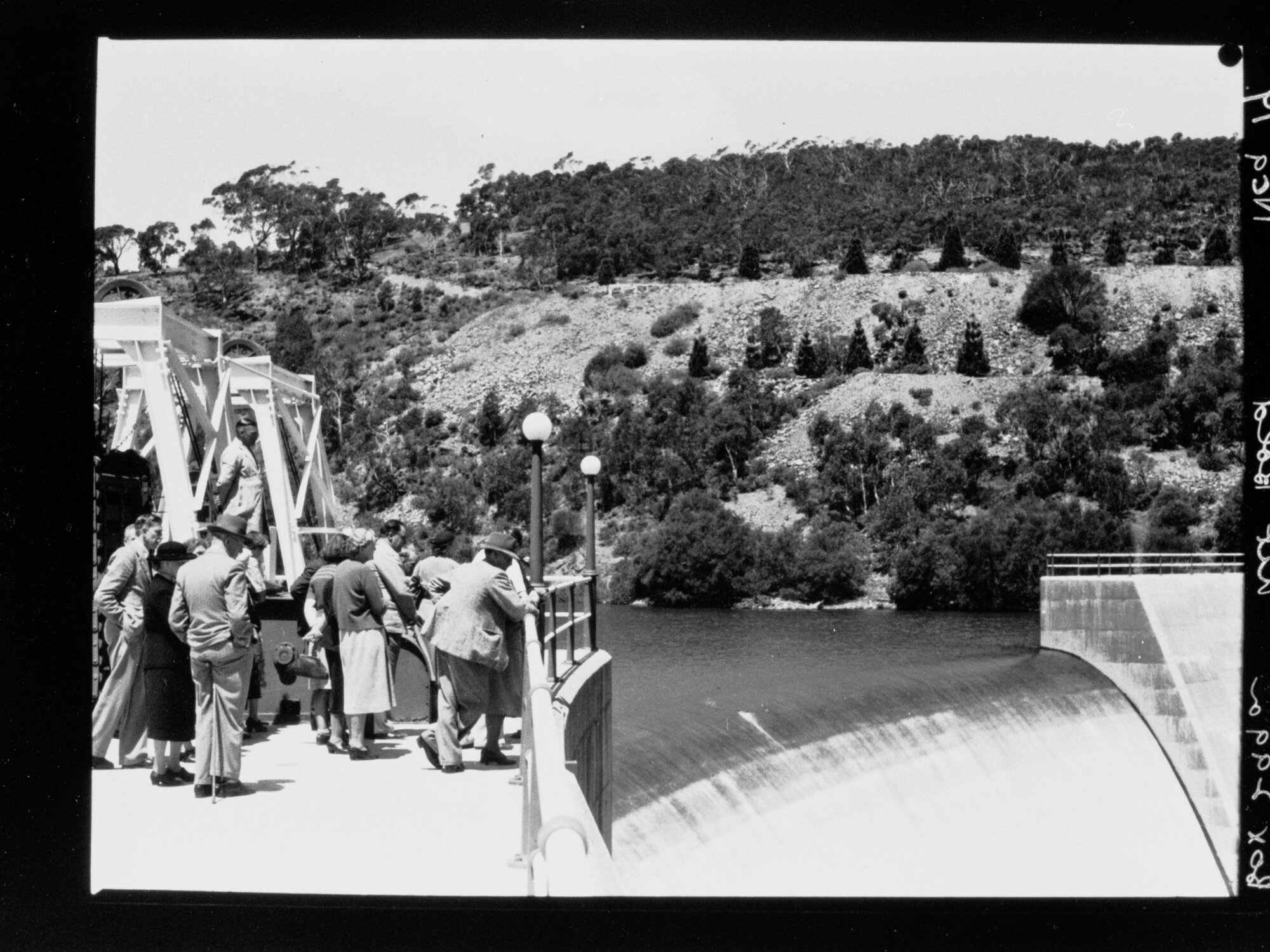 People watching water flowing over the spillway, Mount Bold Reservoir