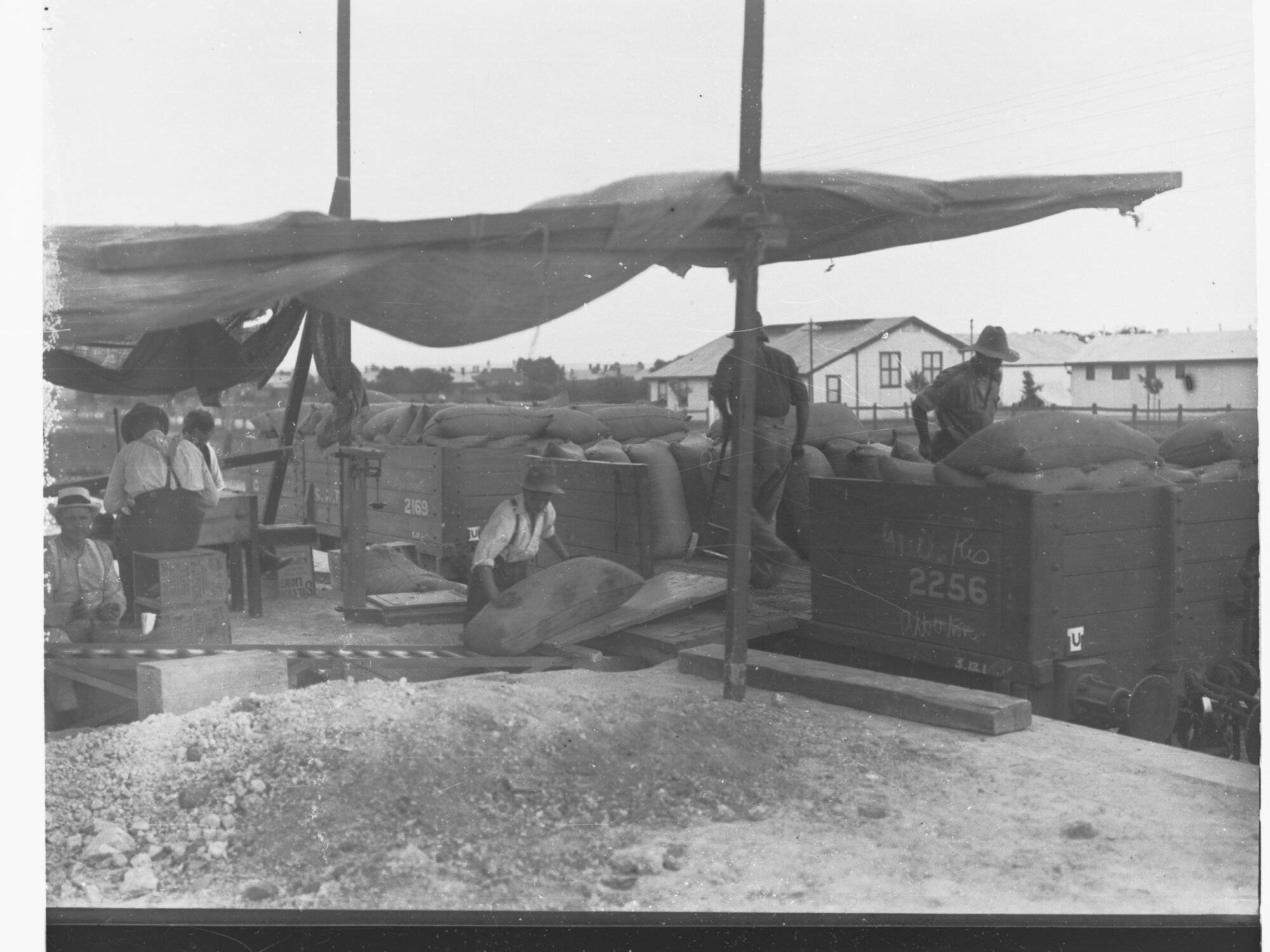 Men Loading a Rail Truck With Sacks of Wheat at Keswick