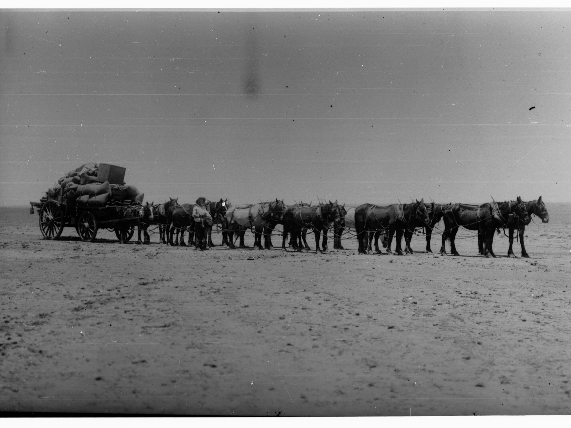 Horses pulling loaded wagon