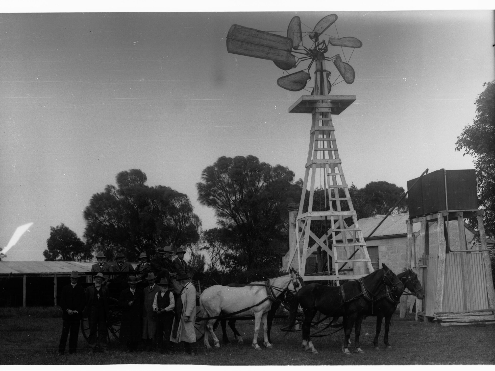 Millicent, showing horse and cart witha group of men in front and windmill behind