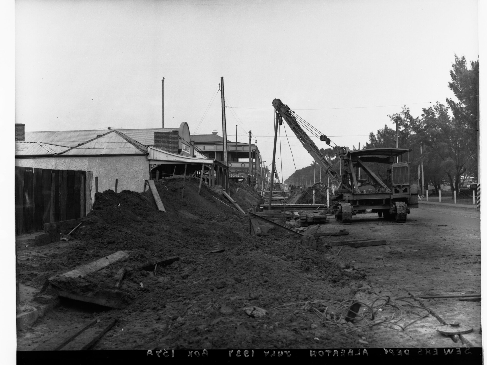 Sewers Department - Alberton, Pipes being laid through street